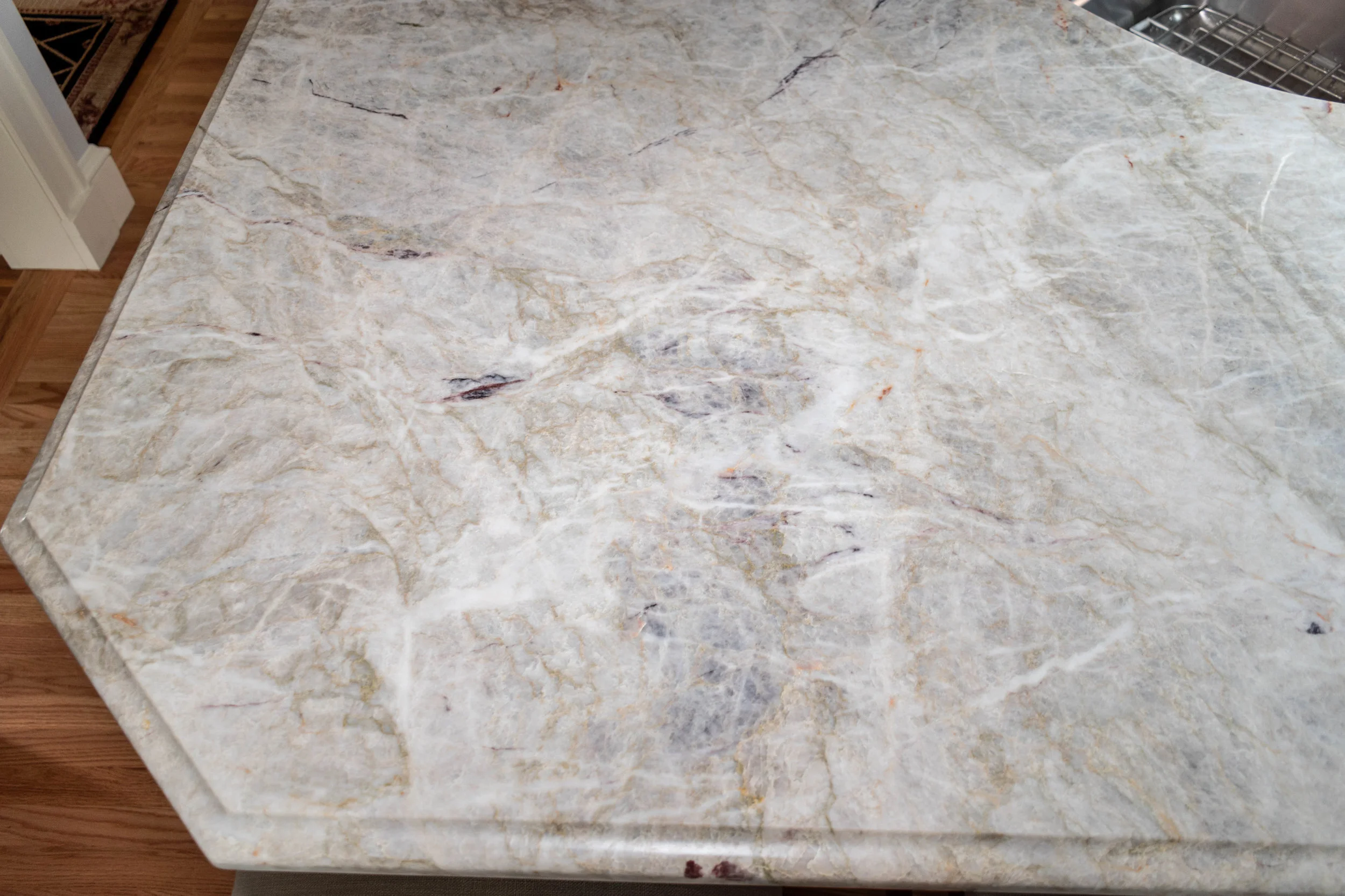 Material: Allure Thickness, Finish & Stone Type: 3CM Polished Quartzite Edge: Ogee Sink: Client’s sink: Under-Mount