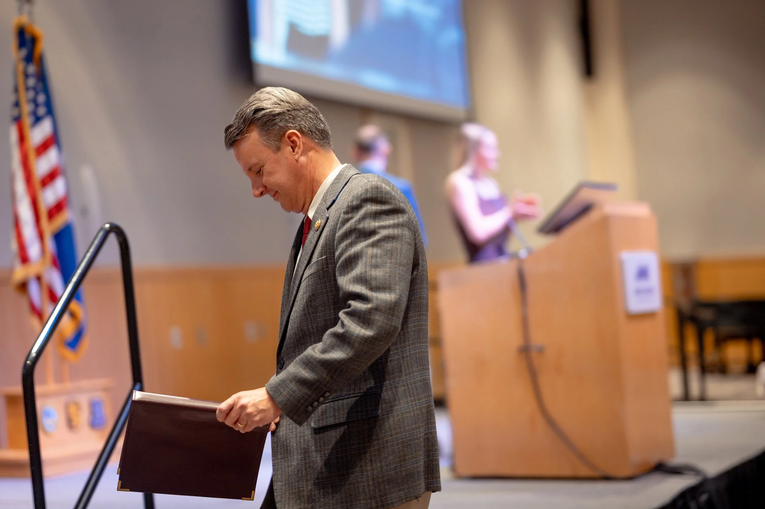  United States Representative Ben Cline (VA-06) reviews his remarks prior to taking the stage during a ceremony honoring former Chief White House Producer and Deputy Chief of Staff Grace L. Sawyer as the inaugural Keith B. Jones Award for Excellence 