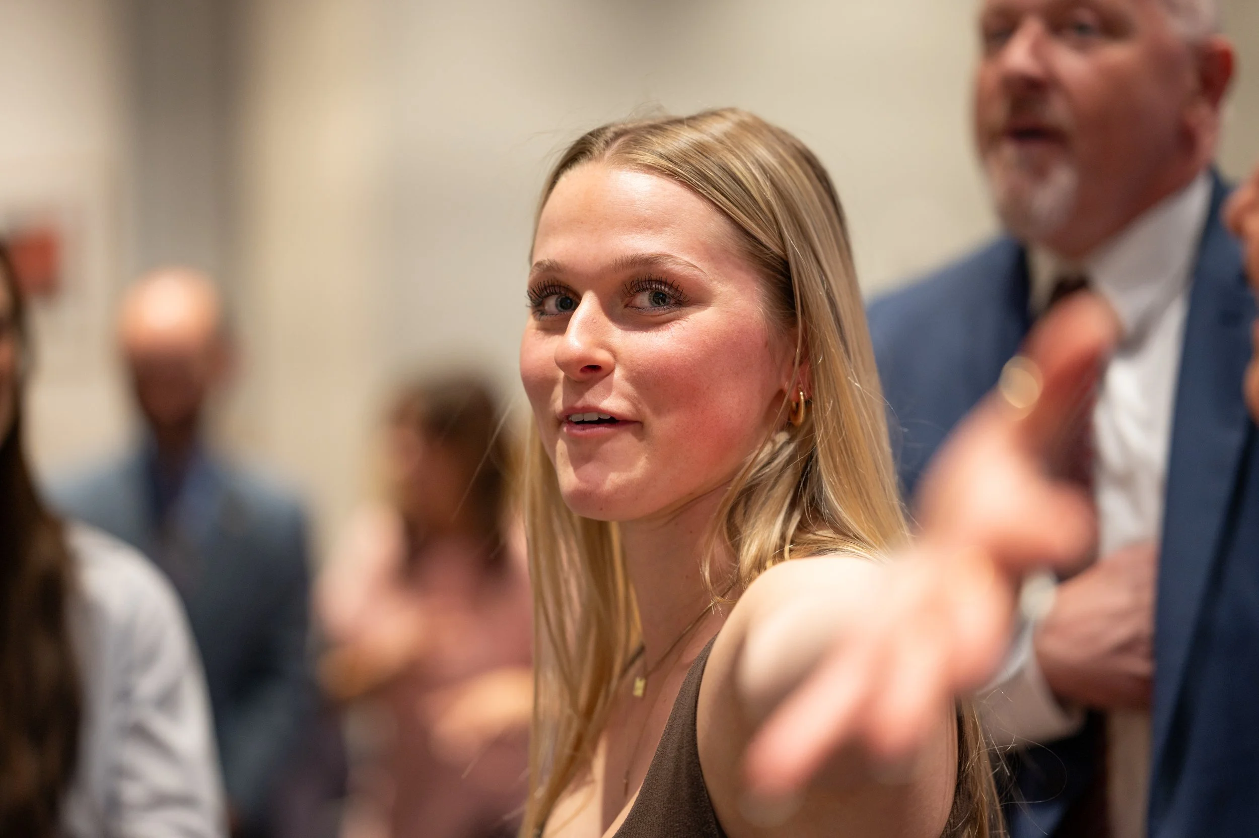  Former Chief White House Producer and Deputy Chief of Staff Grace L. Sawyer takes a moment with her family after being awarded the inaugural Keith B. Jones Award for Excellence in Political Journalism during a surprise ceremony in Harrisonburg, Virg
