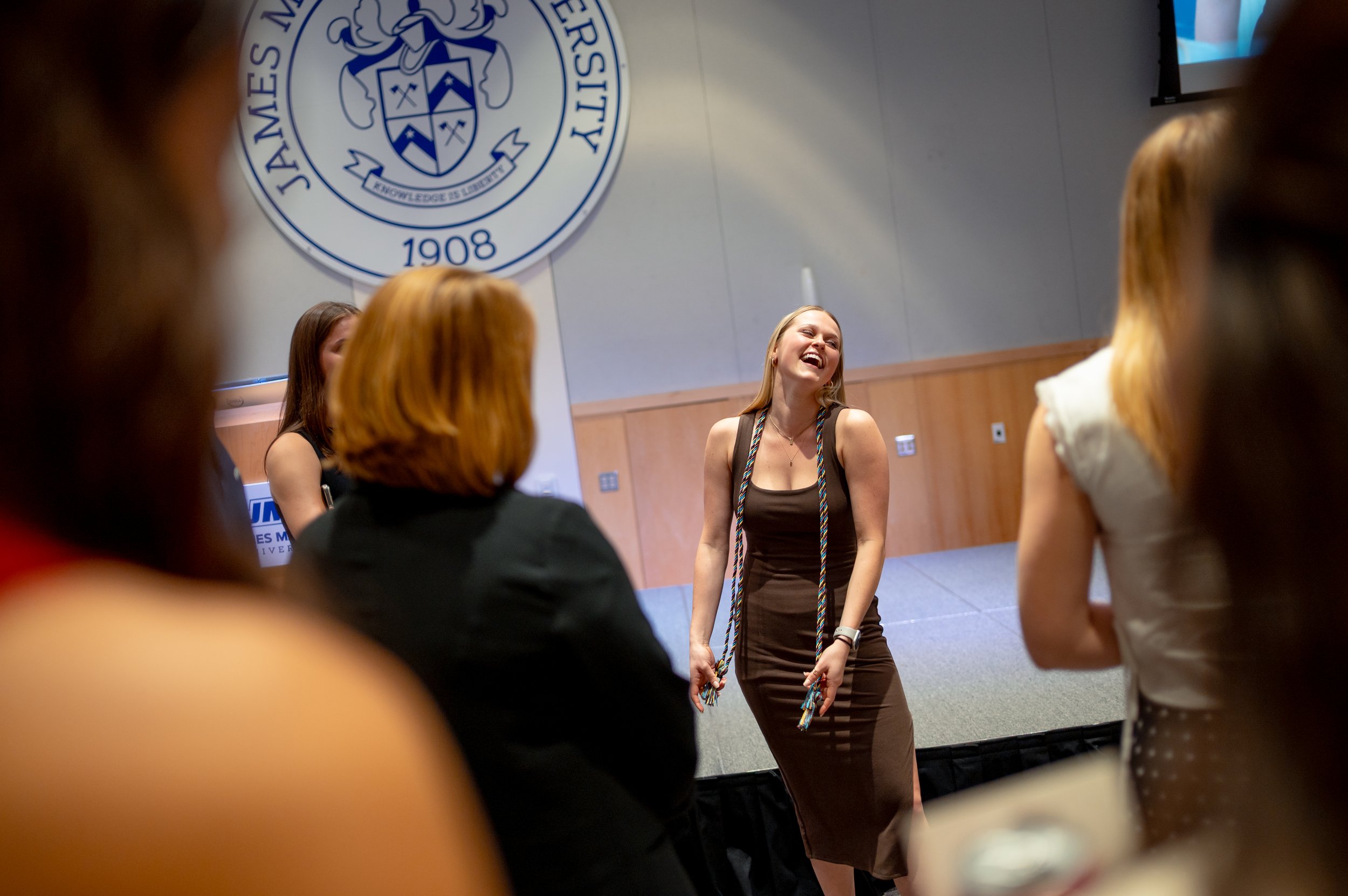  Former Chief White House Producer and Deputy Chief of Staff Grace L. Sawyer takes a moment with her family and close friends after being awarded the inaugural Keith B. Jones Award for Excellence in Political Journalism during a surprise ceremony in 