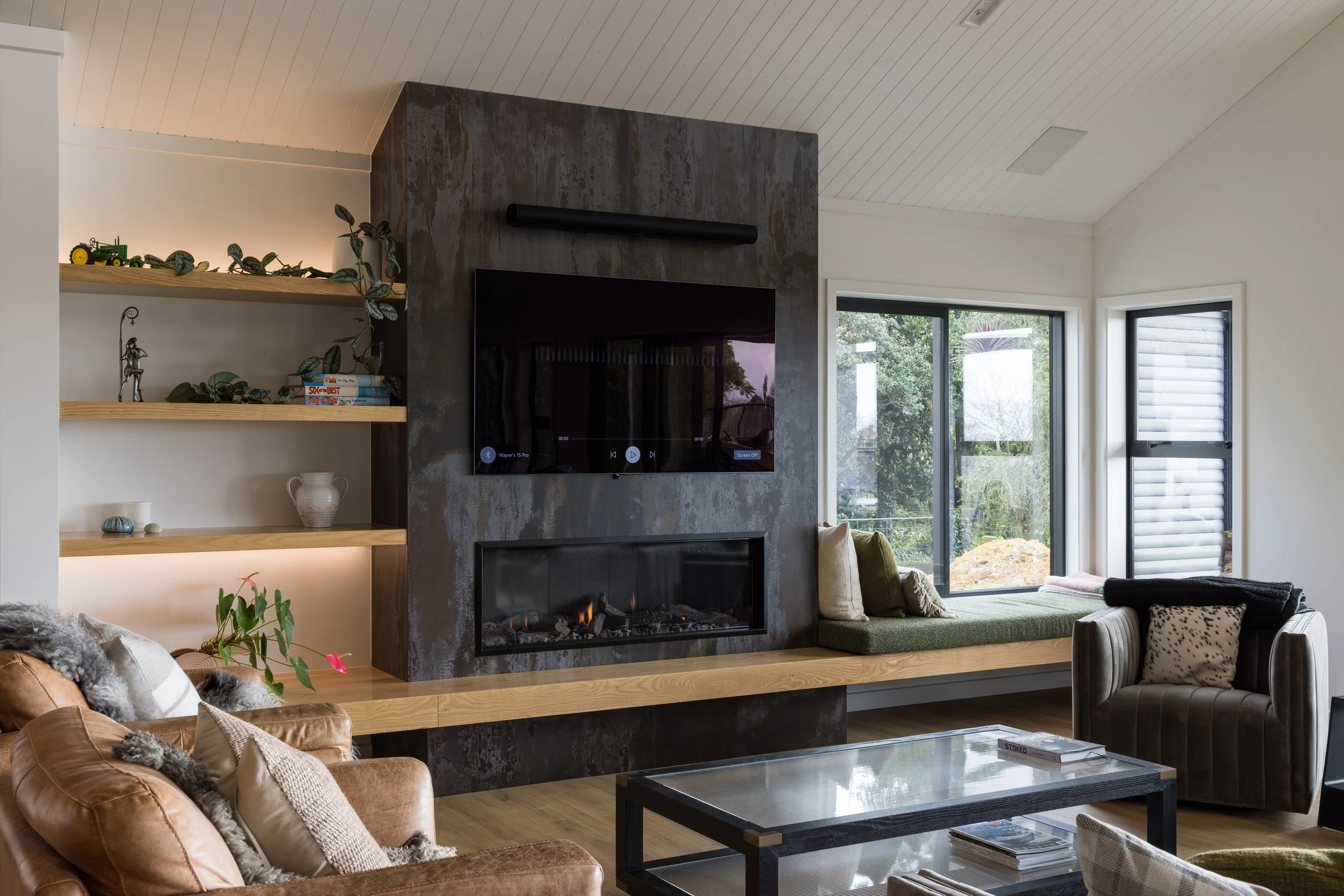 Custom in built cabinetry surrounding fireplace.