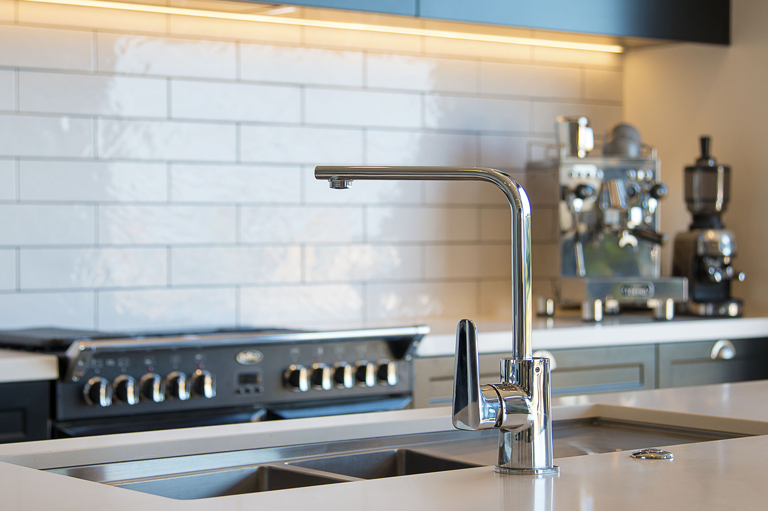 Modern chrome tapware compliments the rustic handles and appliances 