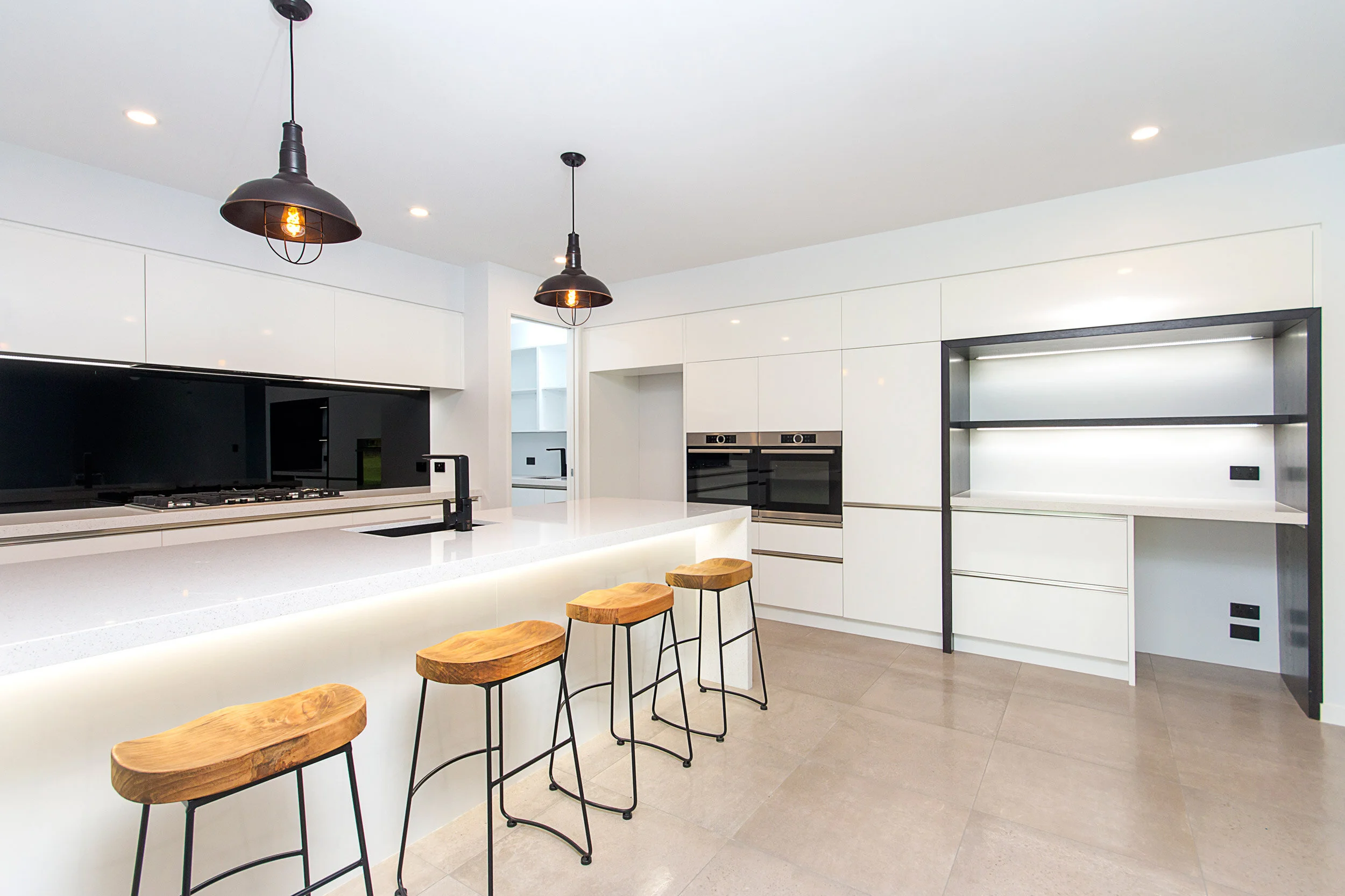 Sleek momochrome kitchen and pantry
