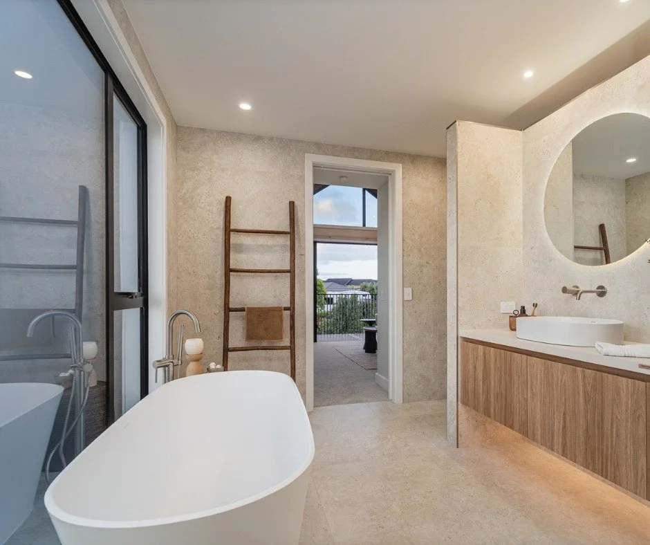 Soft, calming, spa-like. 

The Landmark Homes Whitianga Waterways Showhome  Ensuite and Bathrooms feature large-format porcelain Dekton sheets. This is a low-maintenance, ultra-luxe finish that gives the look of natural stone without the upkeep. In t