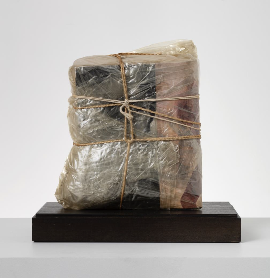  Christo,  Wrapped Magazines , 1965. Polyethylene, rope and magazines, 12 ½ x 11 ½ x 5 inches.  