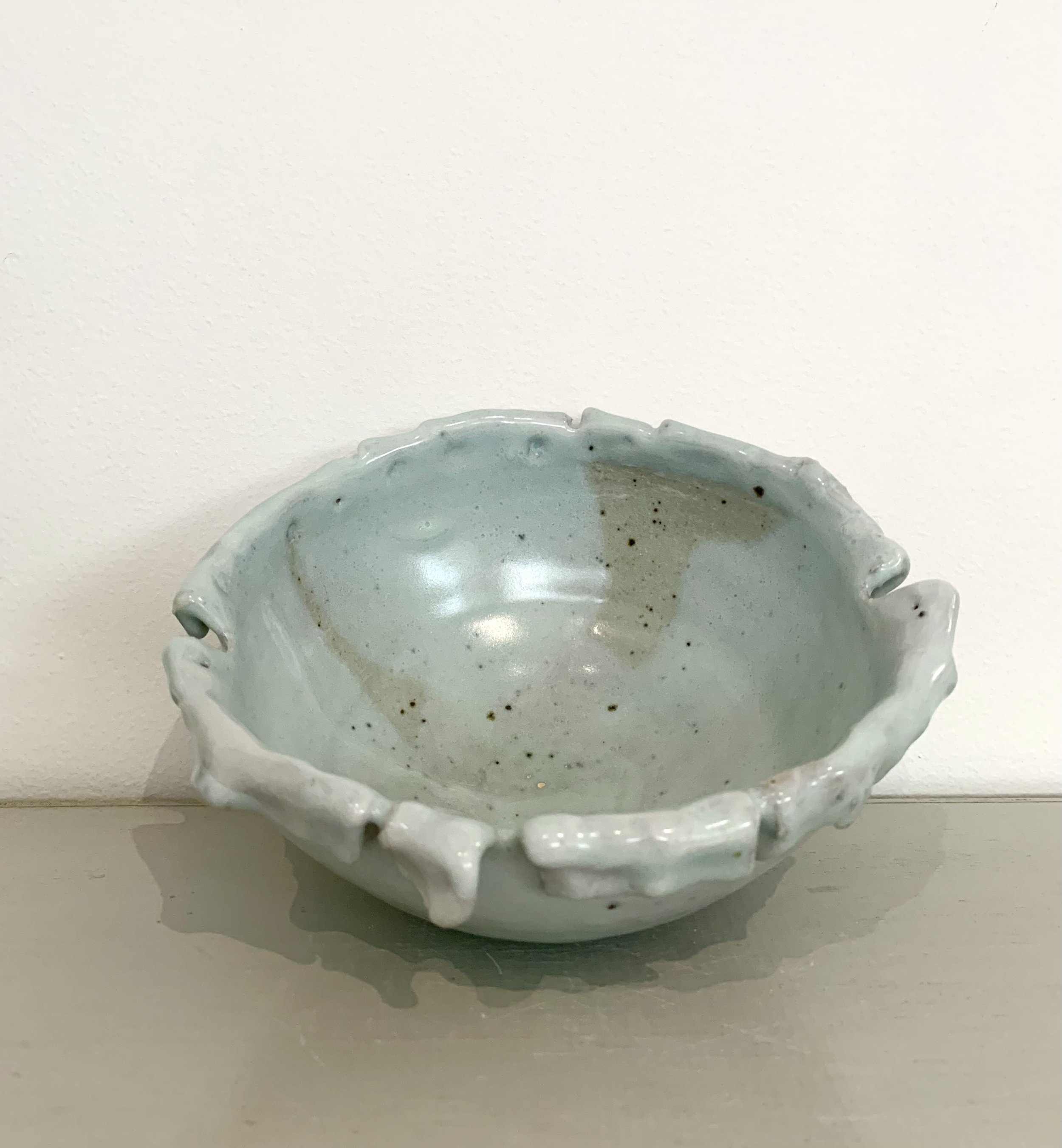 Medium fold-edged footed bowl, shino and ash glazed stoneware