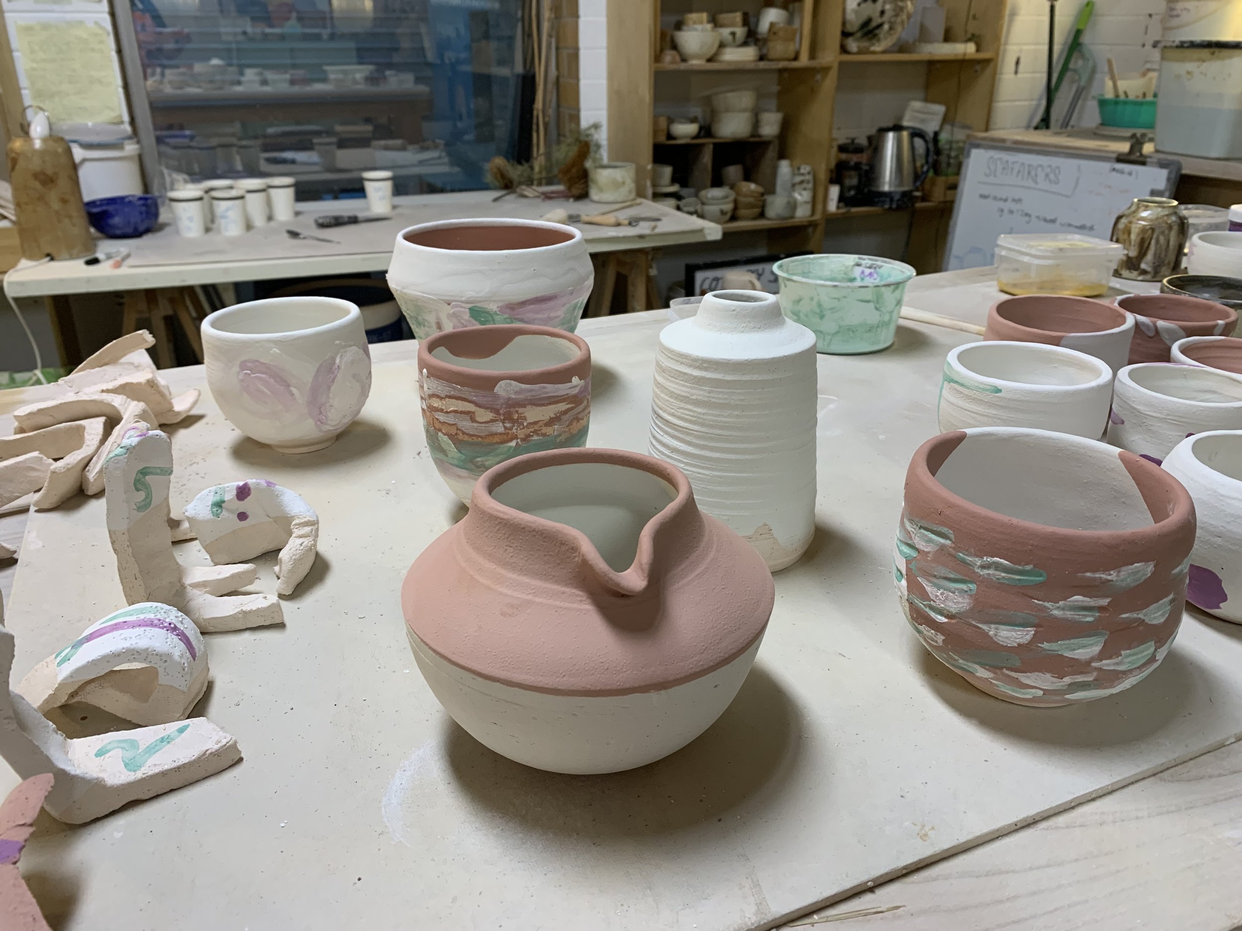 Testing glazes and oxides incorporating reclaimed materials on different clay bodies