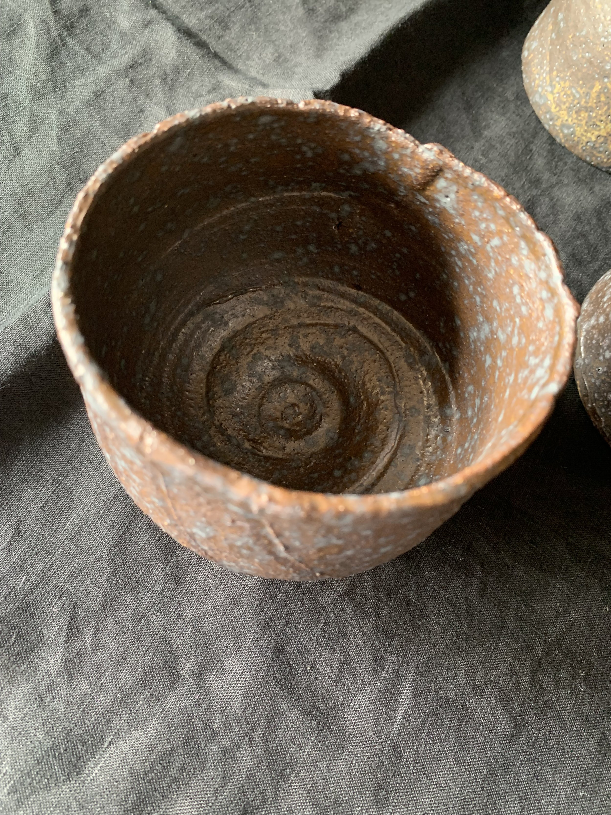 Reduction fired dark stoneware cup