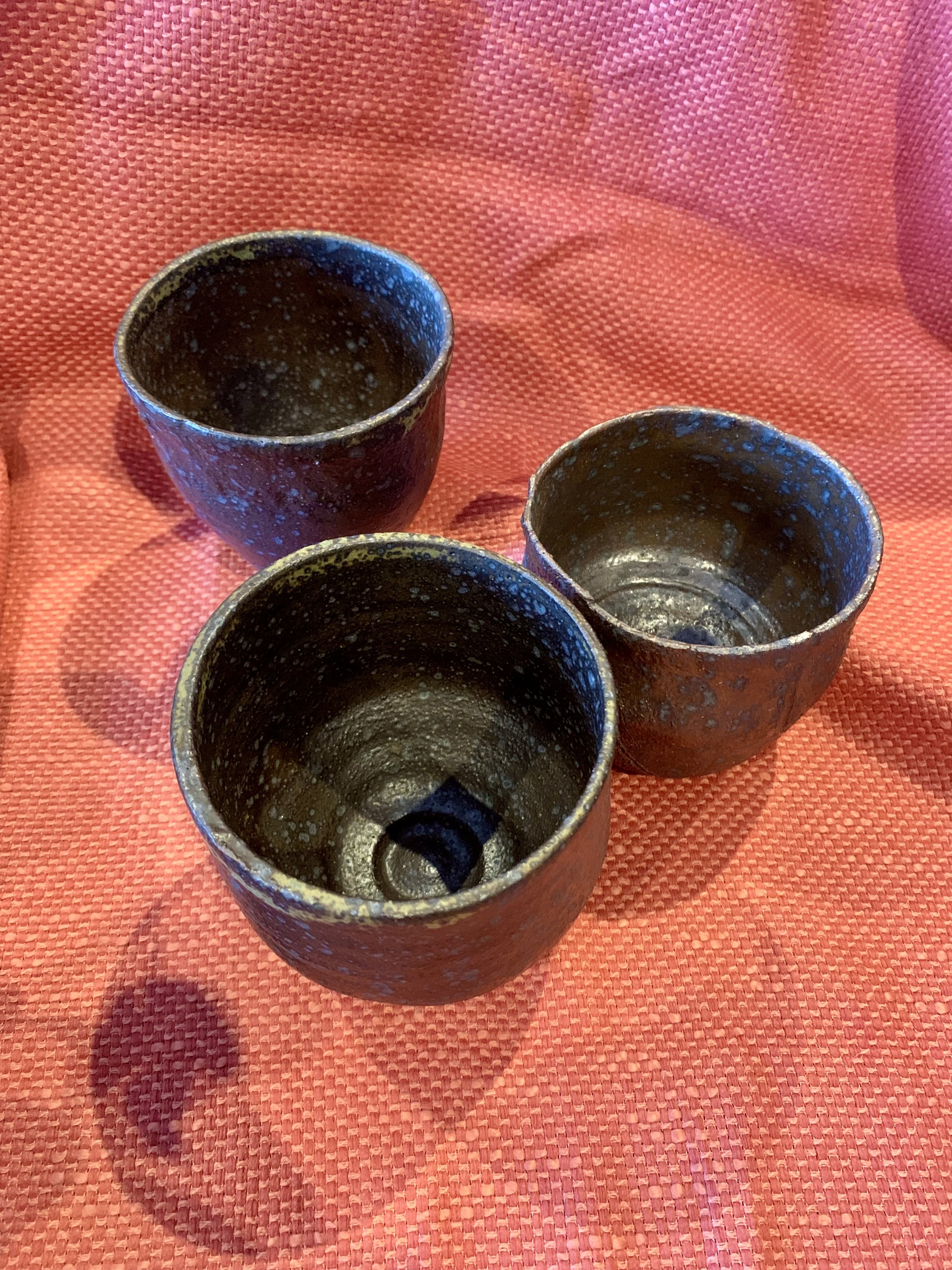 Three reduction fired stoneware cups