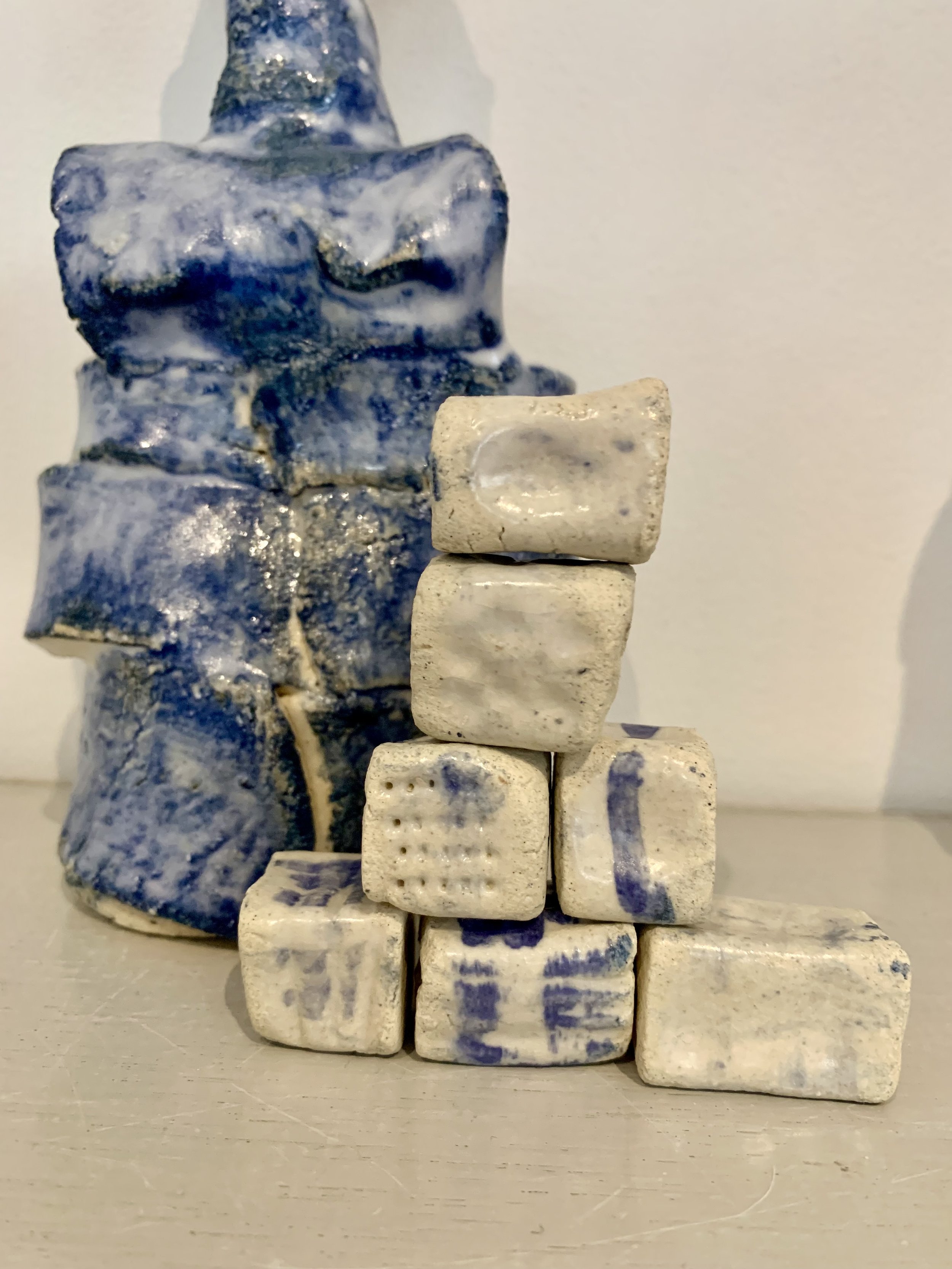 Blue figure with textured beads, 2025, Raku clay, coloured slip, glaze
