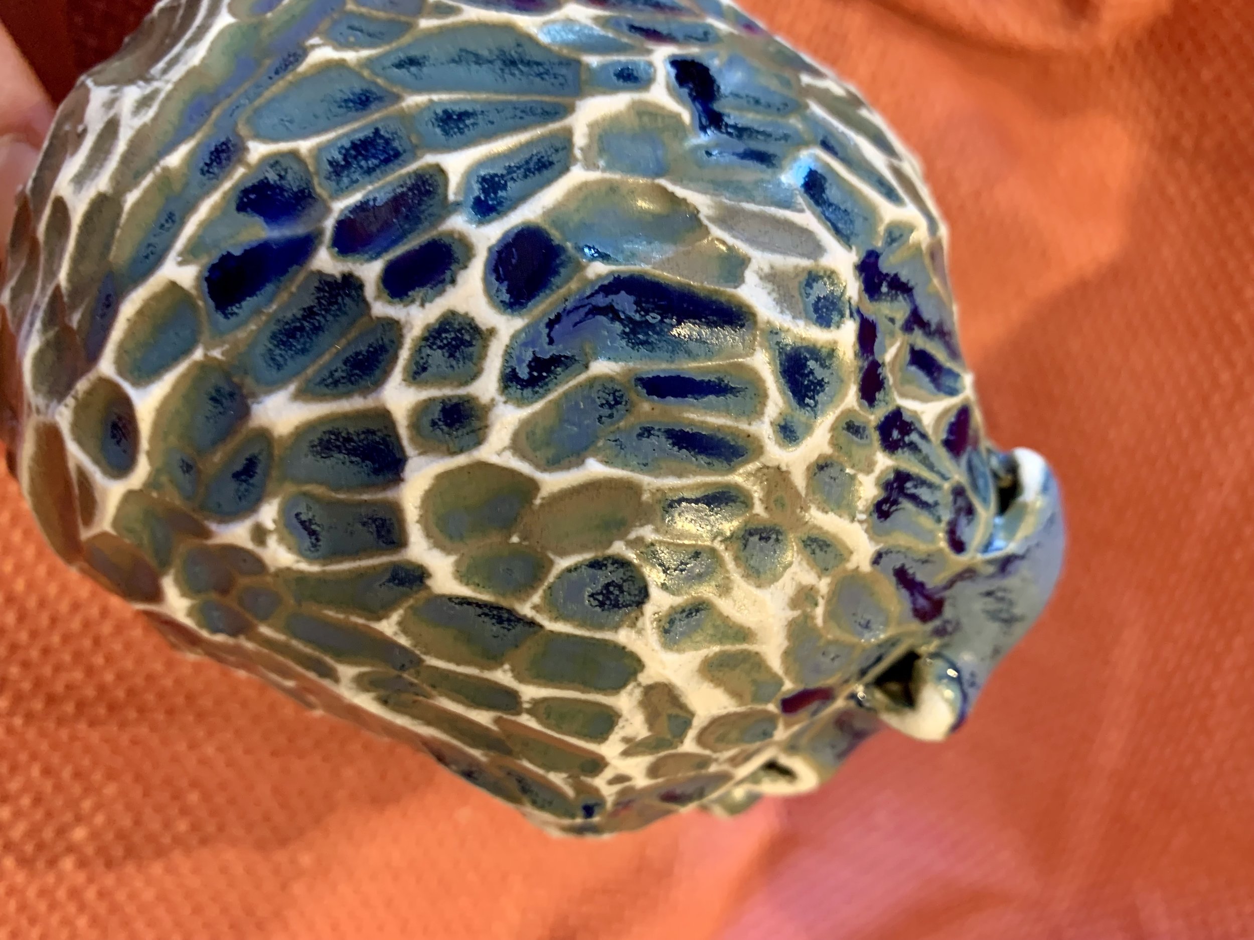 Detail, frill necked and softly faceted thrown and altered vase, glazed stoneware