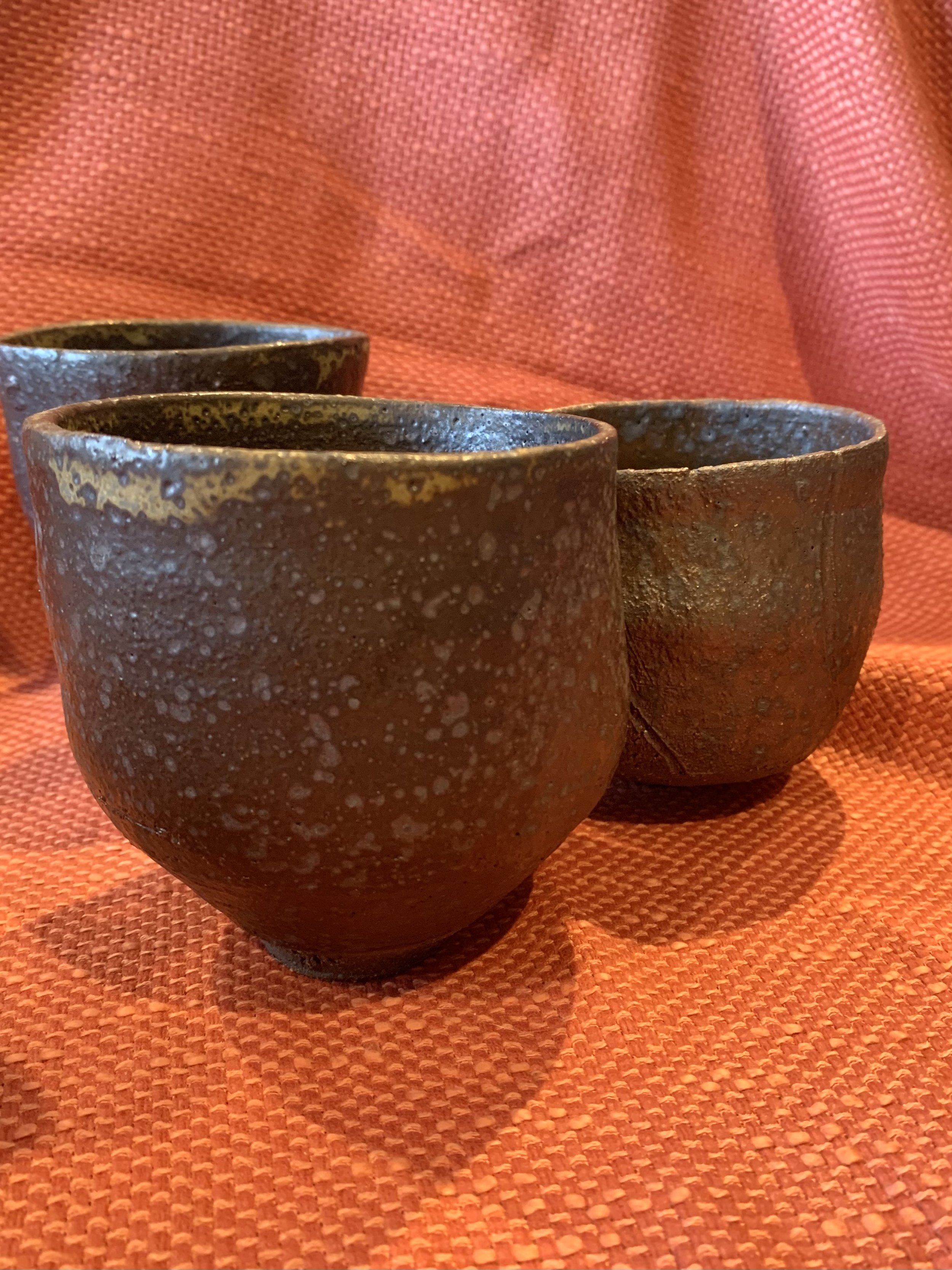 Tapered cup, dark reduction fired stoneware
