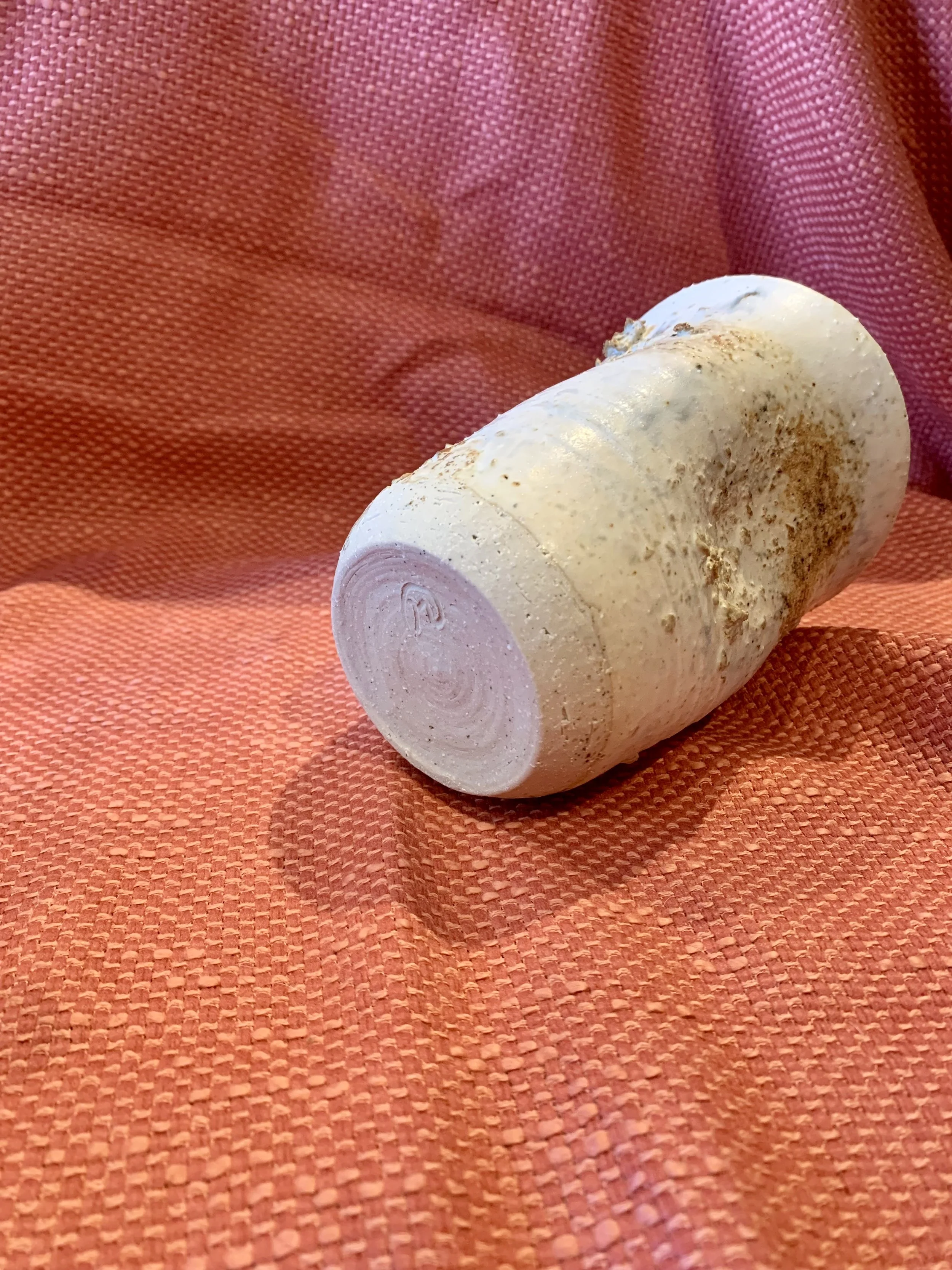 Thrown and altered stoneware vase with texture and oxide colouring