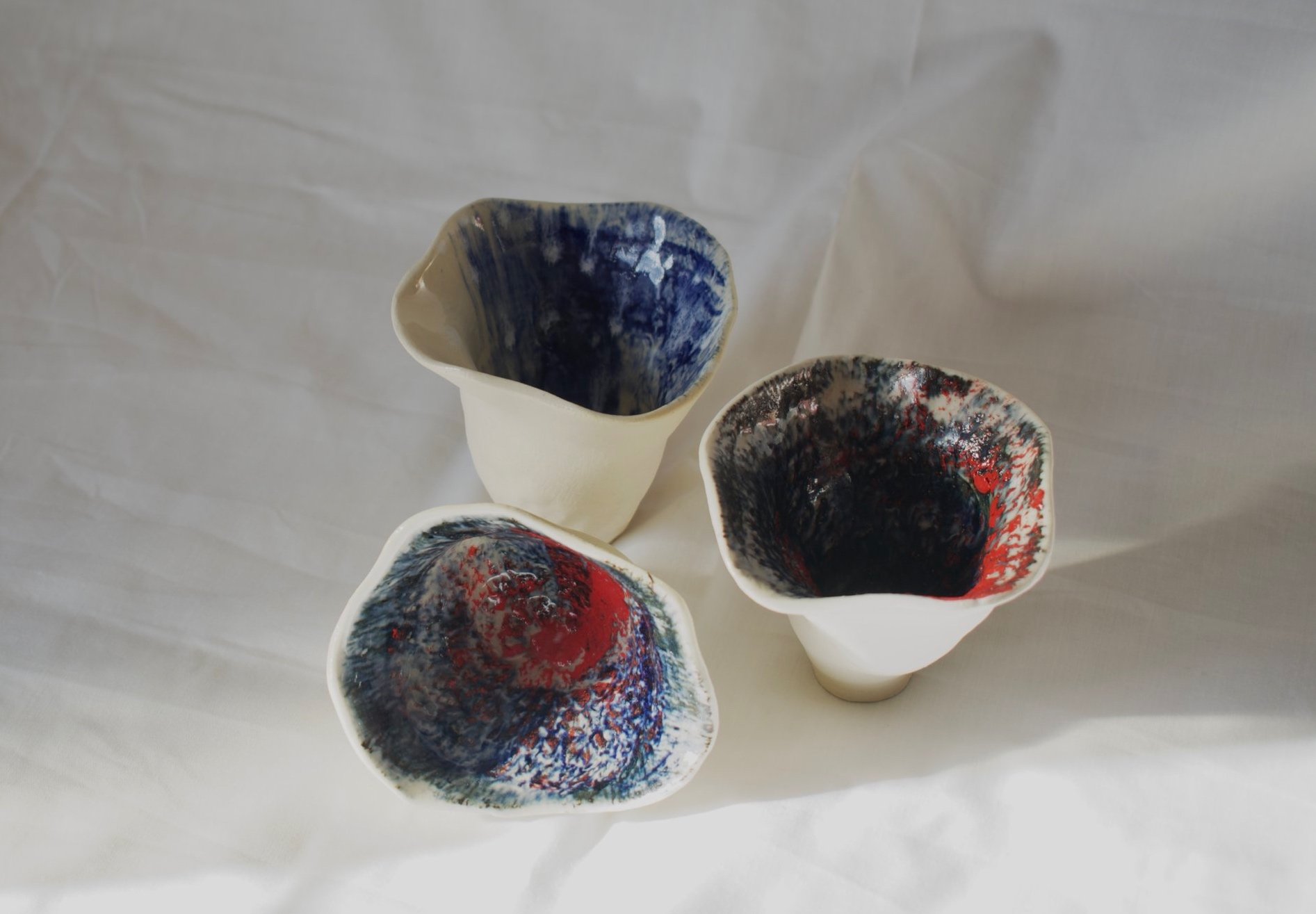 Small shell forms, 2025. Thrown and altered stoneware with slips, oxides, and glaze