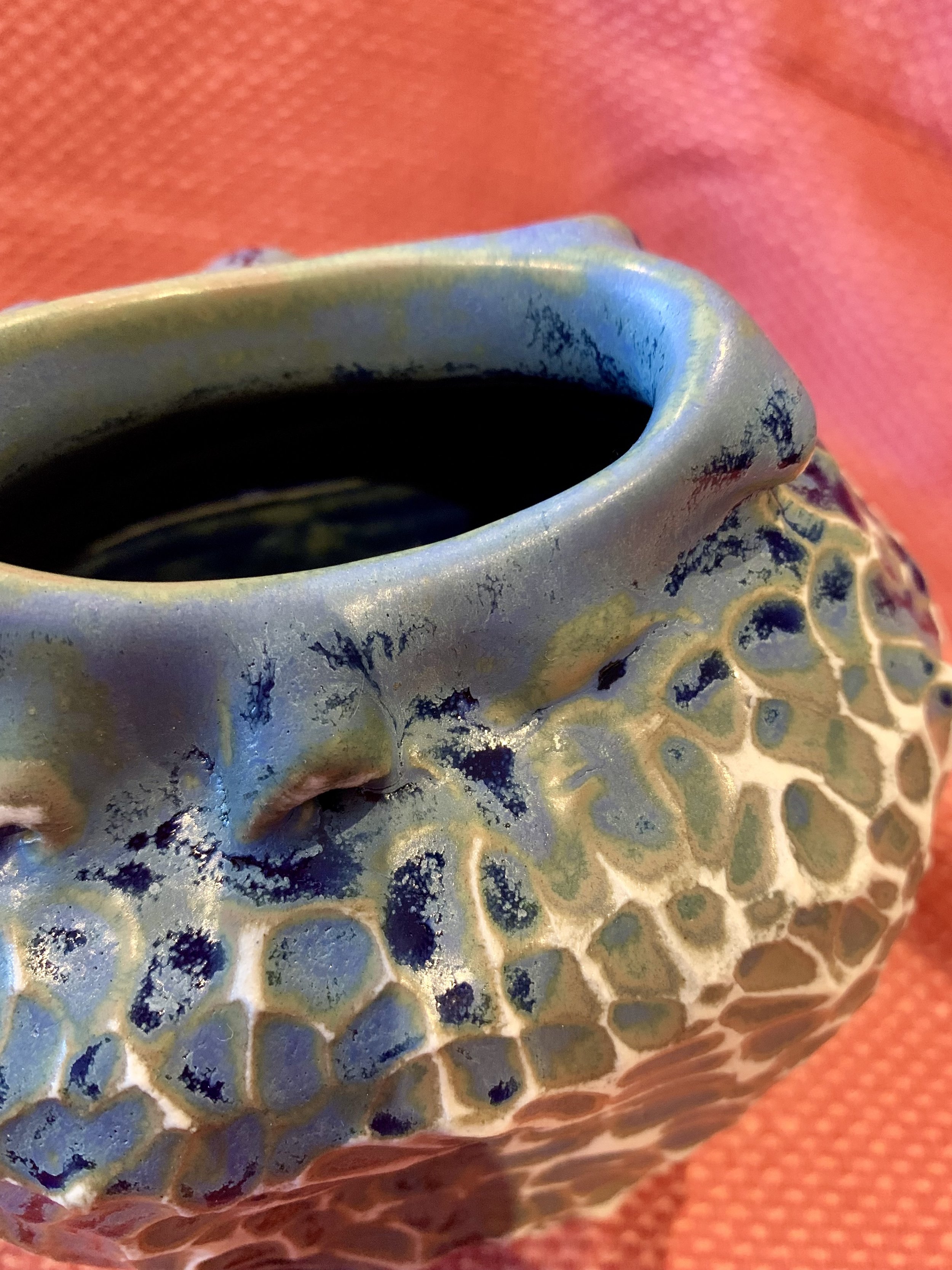 Detail, frill necked and softly faceted thrown and altered vase, glazed stoneware
