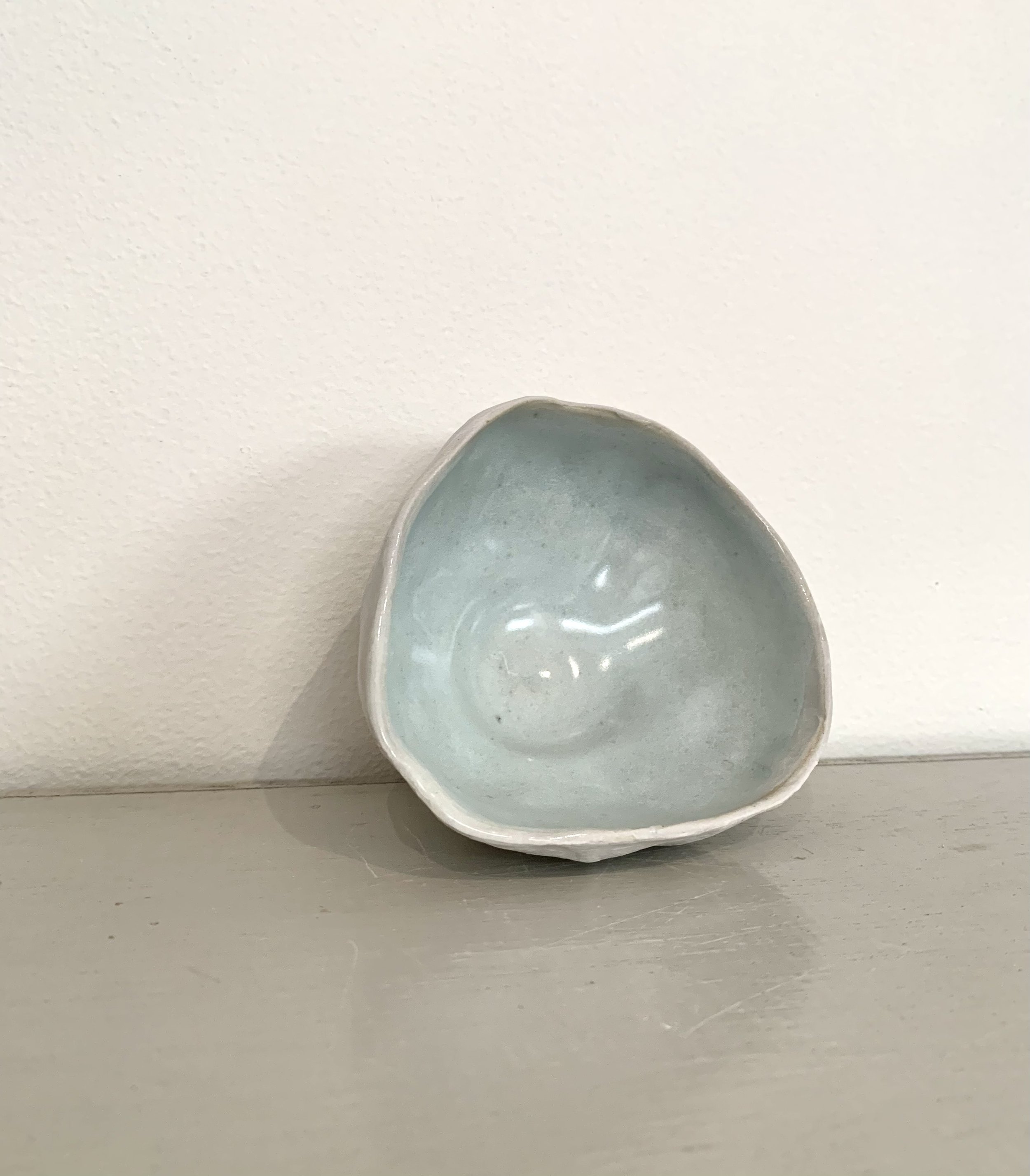 Small shell bowl, slip with shino and ash glaze