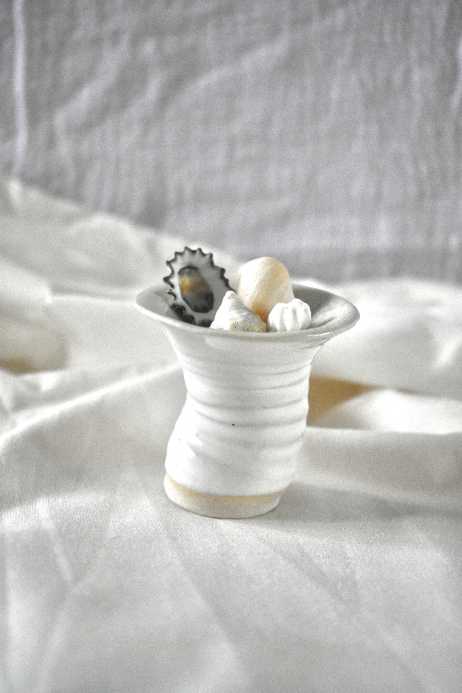 Small shell form, 2025. Thrown and altered stoneware with oxides, and glaze