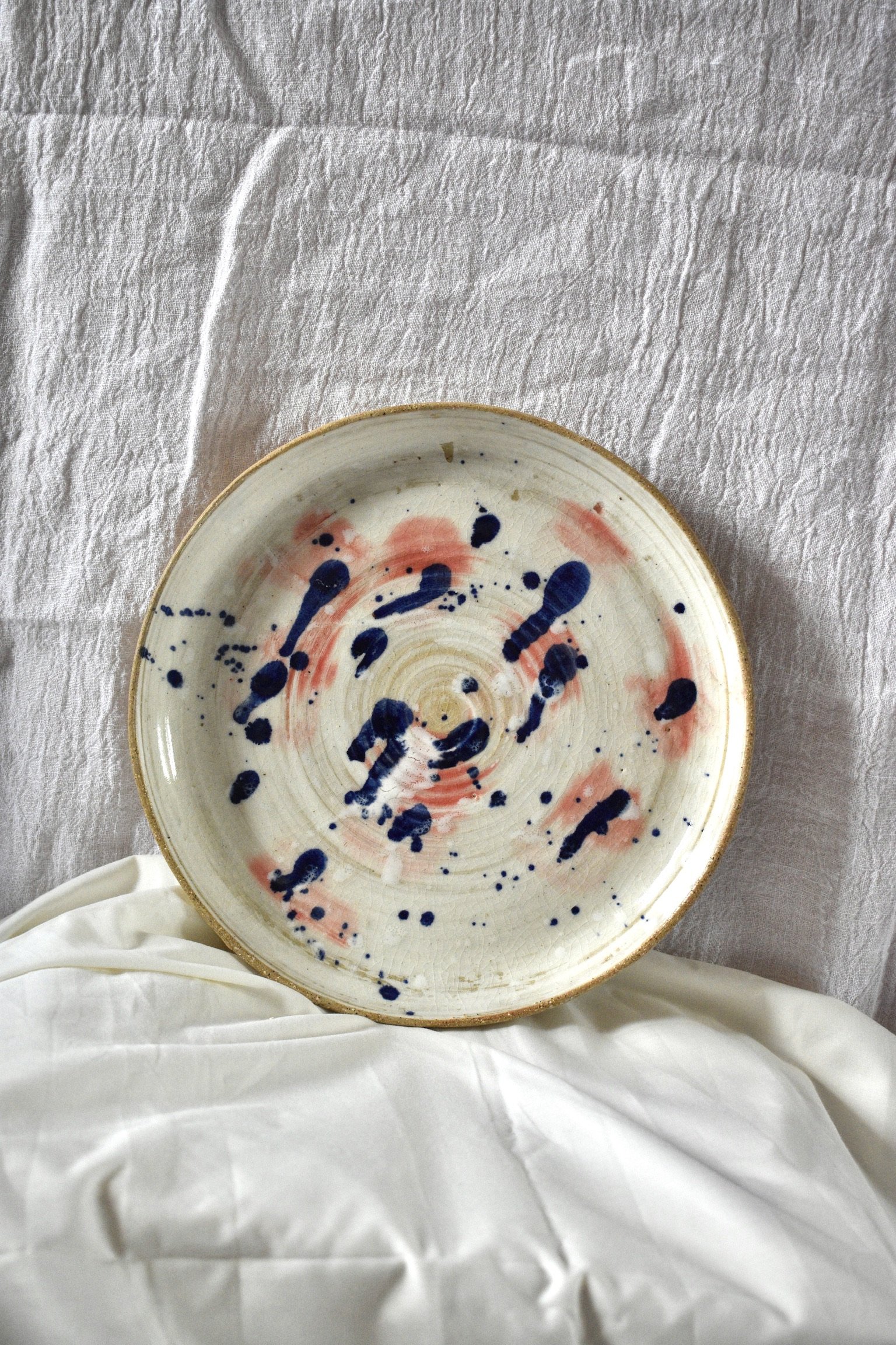 Large, stoneware serving plate with slip, oxides, and glaze