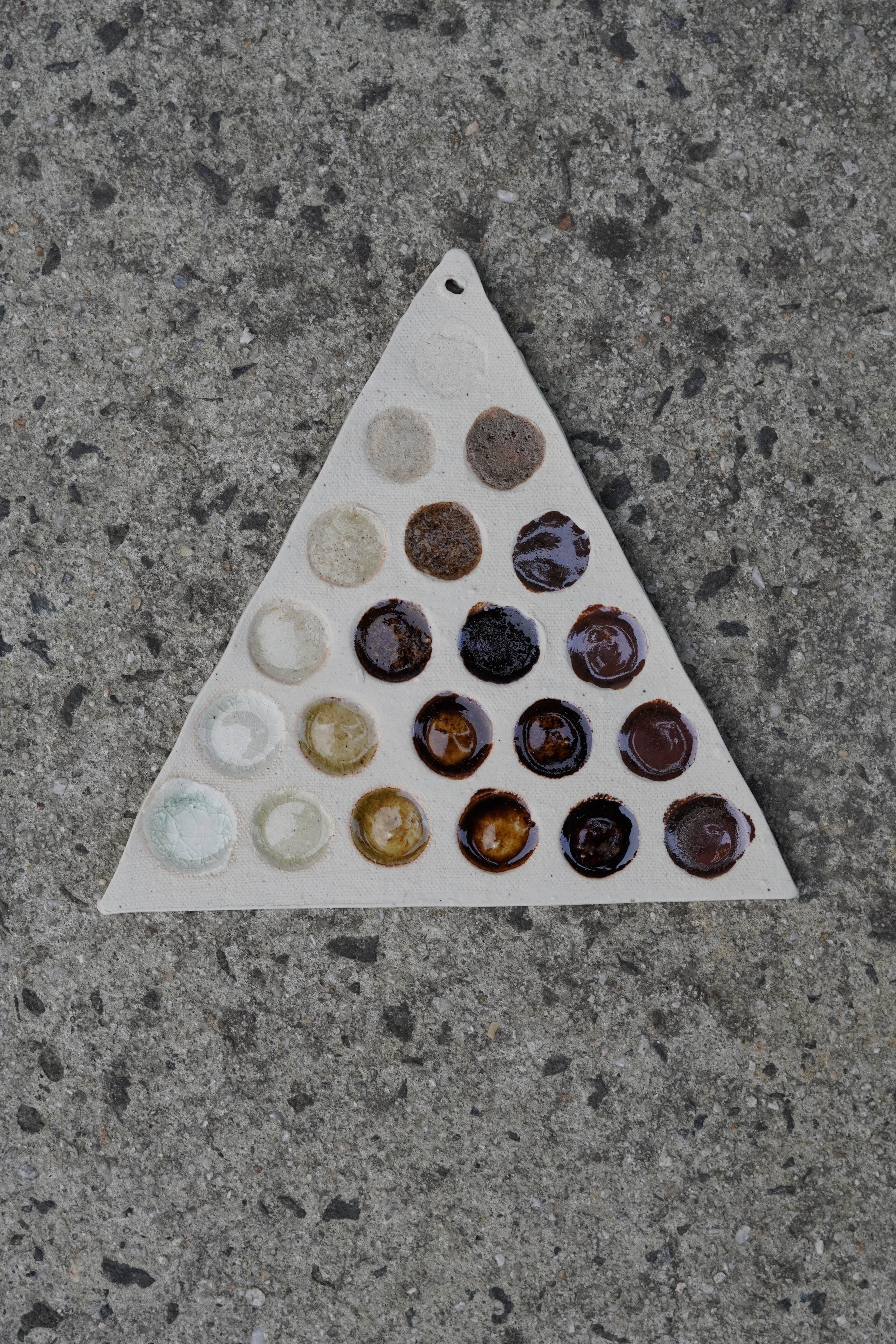 Triaxial tests of glazes made from gathered and reclaimed material including eggshell, seashells, basalt rock, and glass