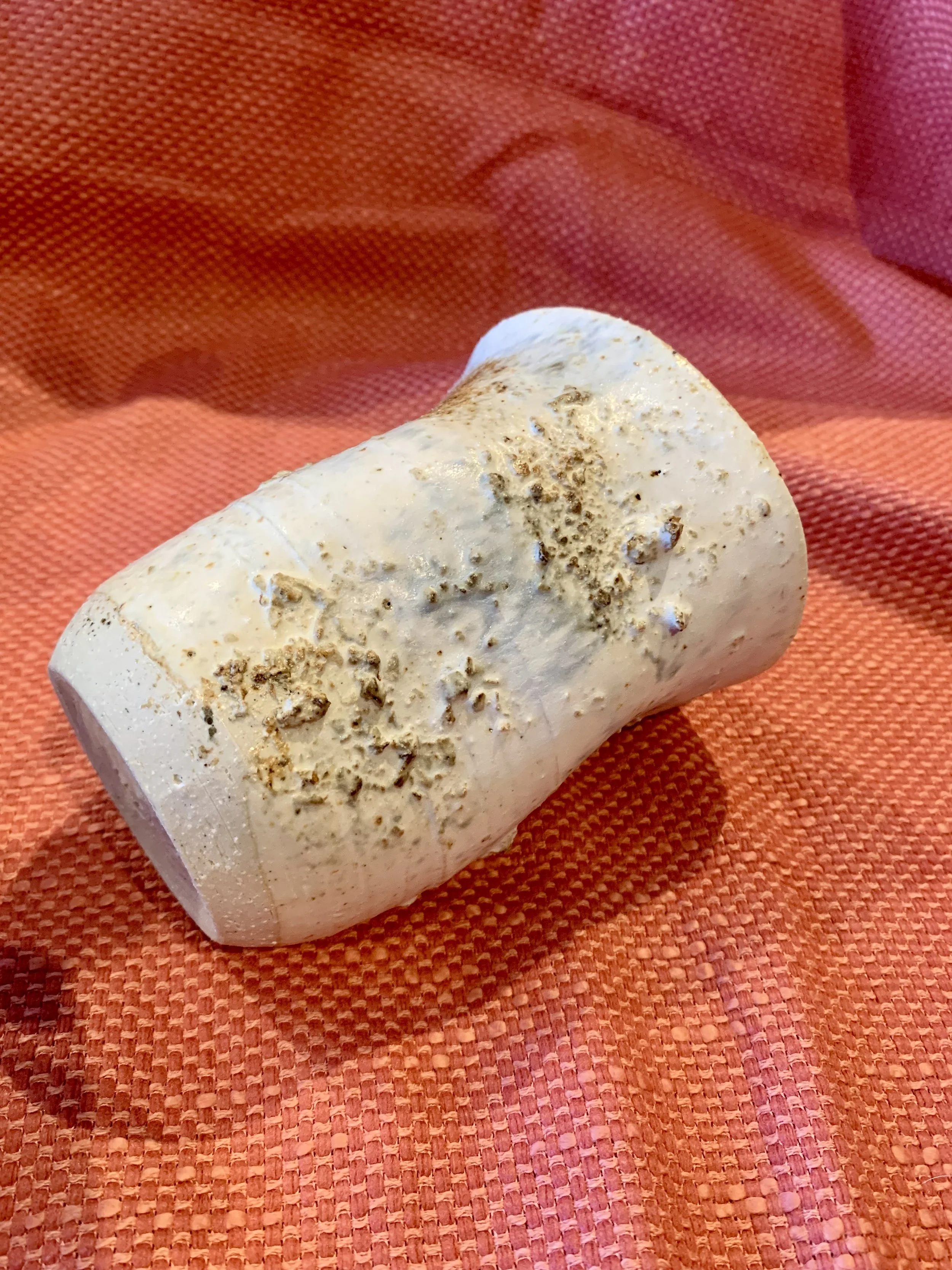 Thrown and altered stoneware vase with texture and oxide colouring