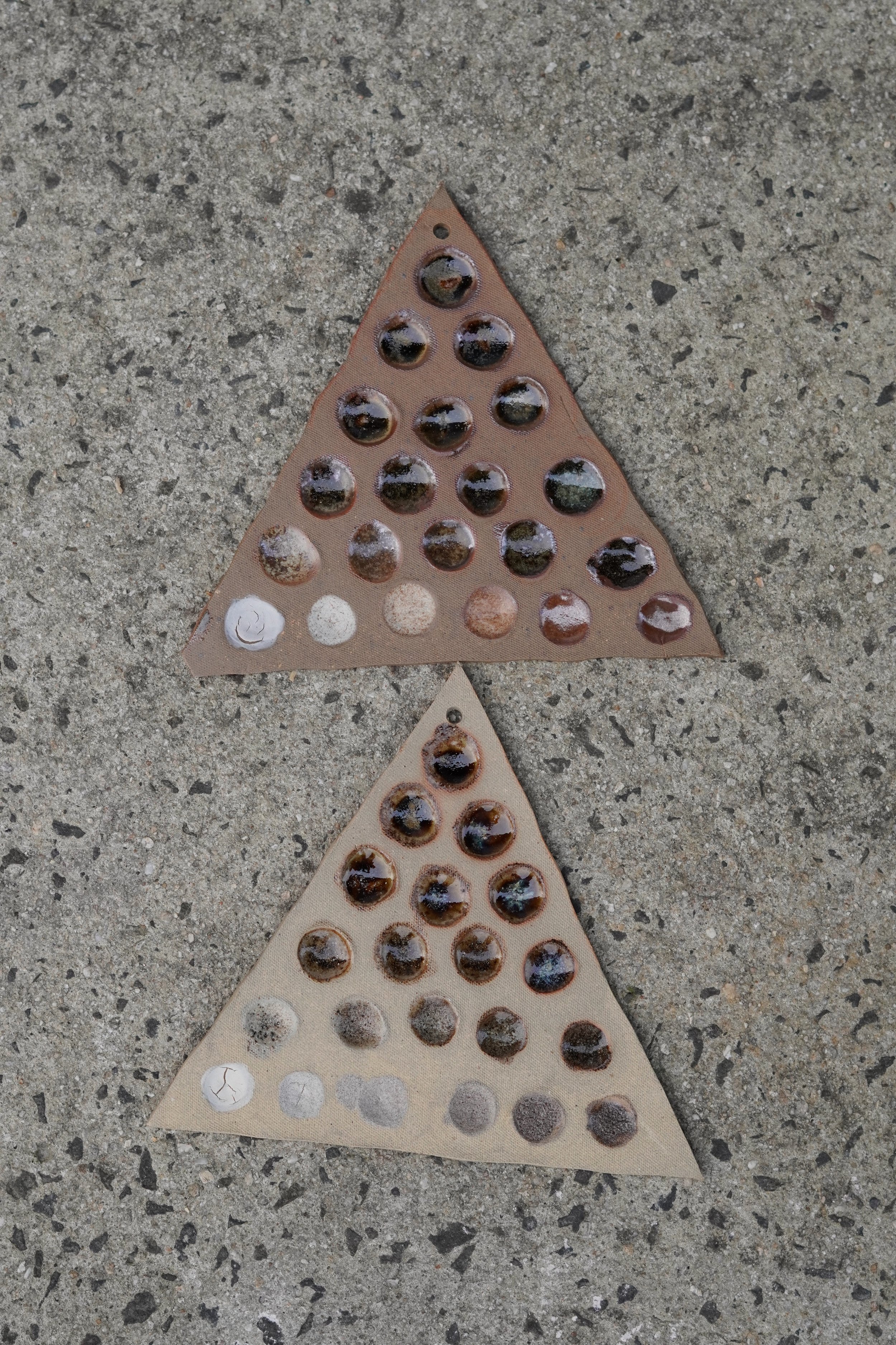 Triaxial tests of glazes made from gathered and reclaimed material including eggshell, seashells, basalt rock, and glass