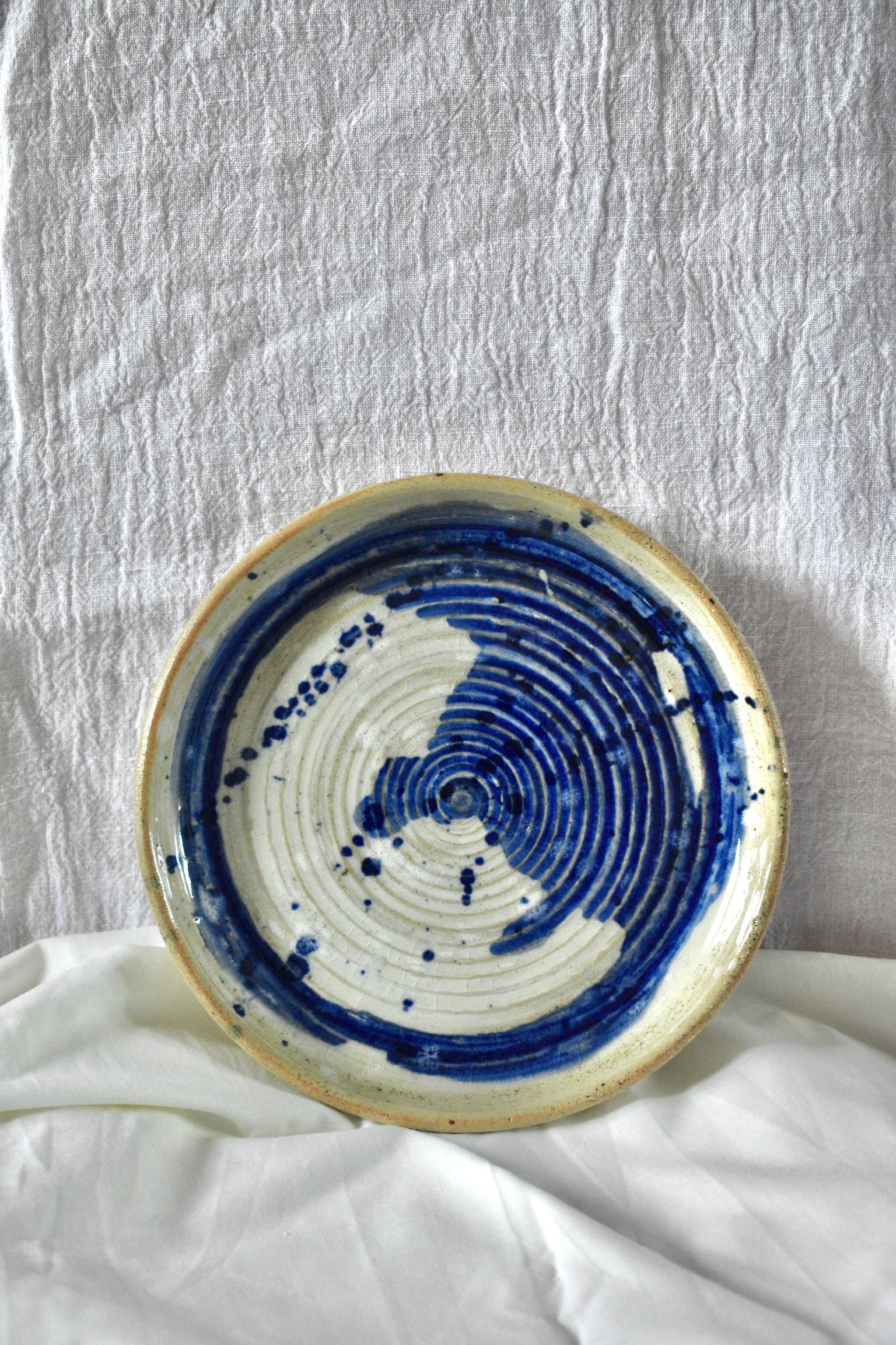Slip and oxide decorated side plate, glazed stoneware