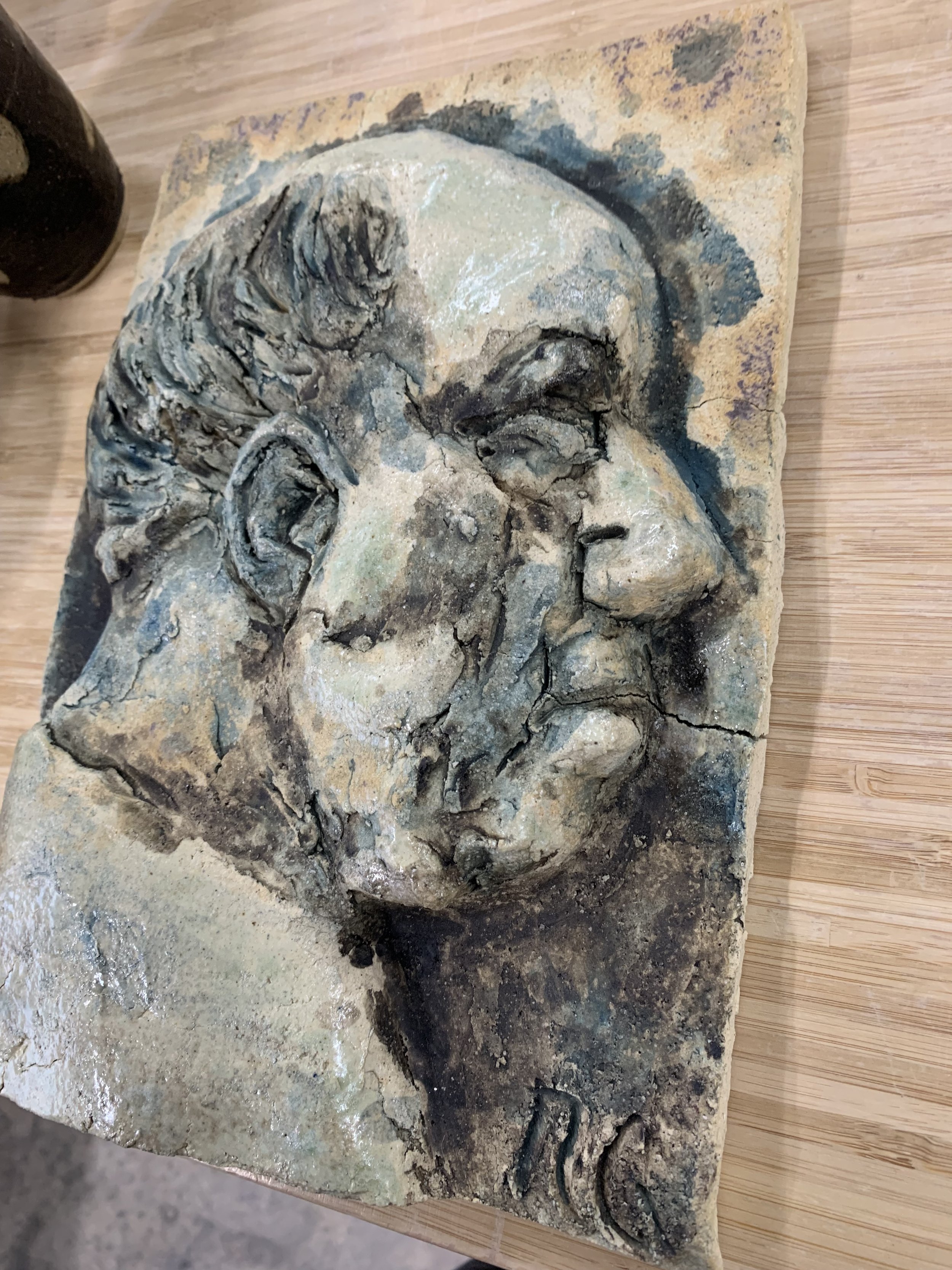 Profile relief, 2024, Raku clay, coloured slips, oxides, and glaze