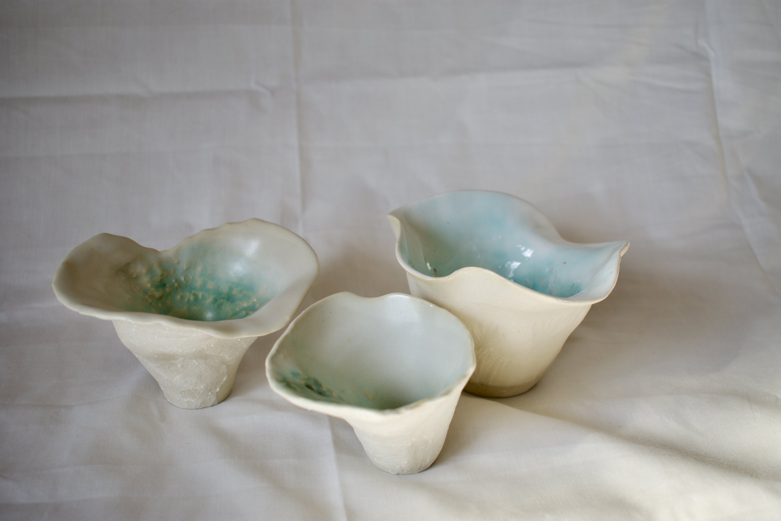 Shelter, 2025. Thrown and altered stoneware with layered slips, oxides, and glaze.