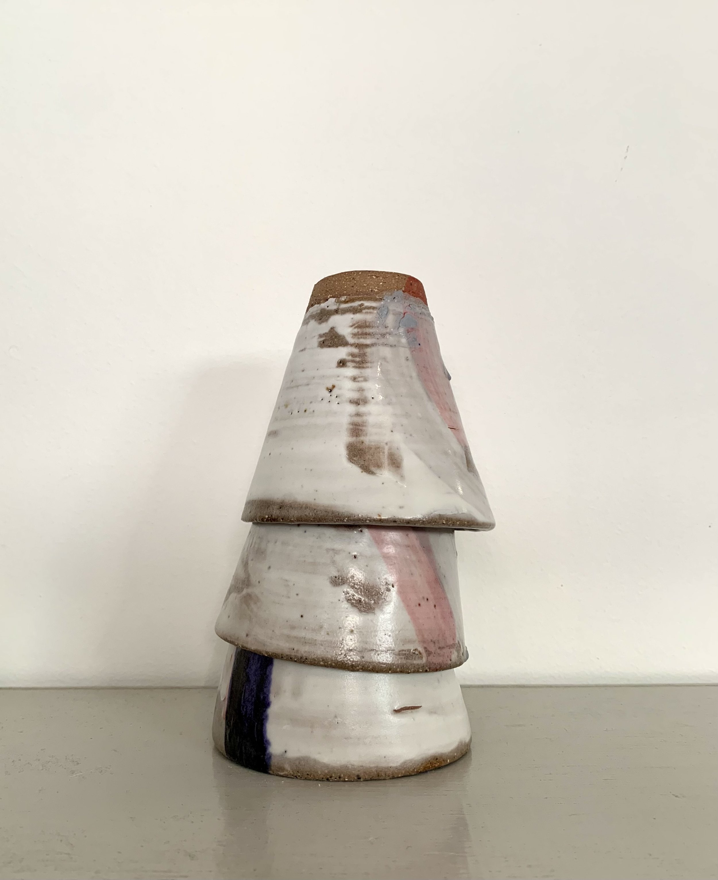 Three slip decorated stoneware tumblers