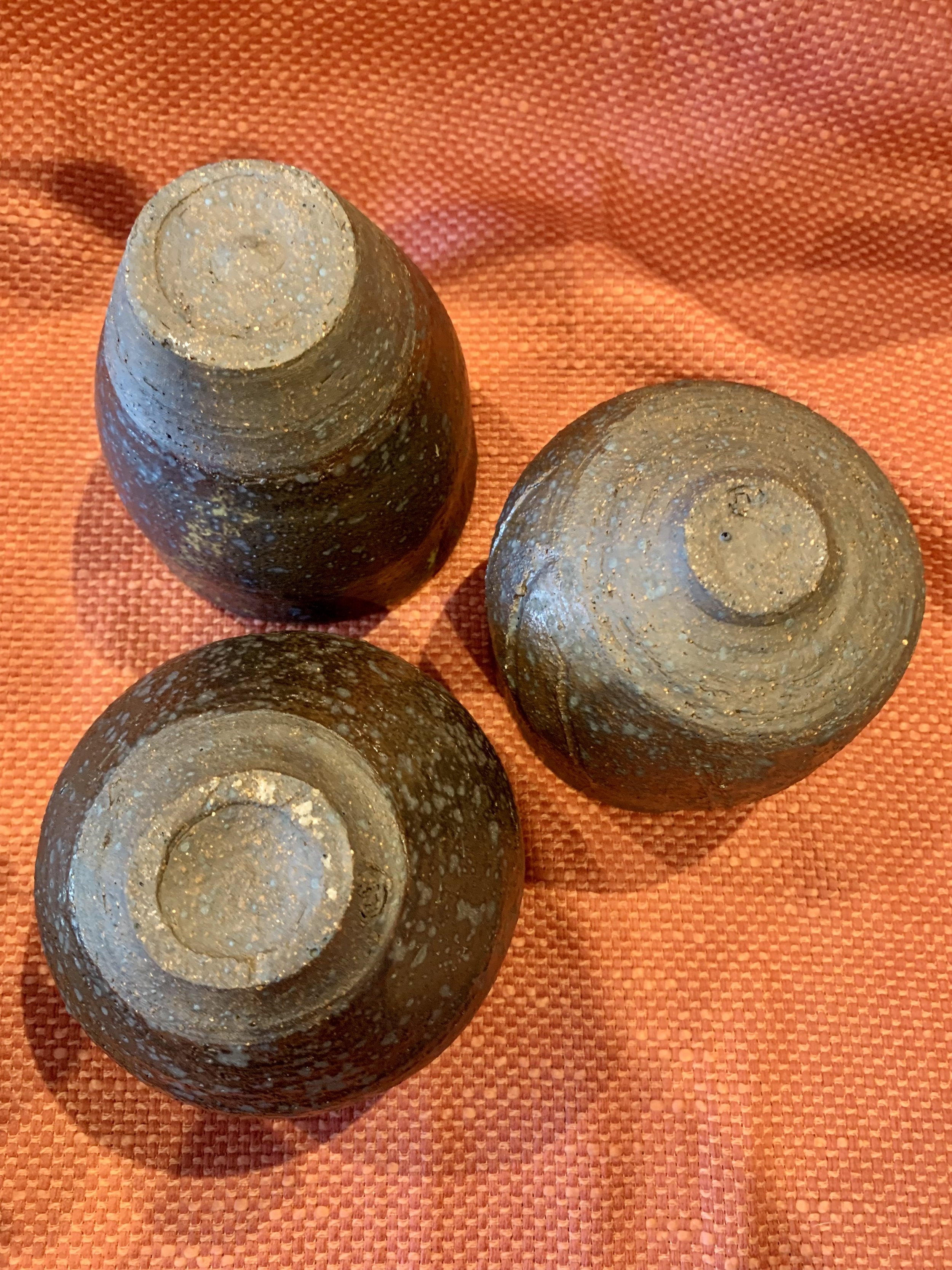 Three reduction fired stoneware cups