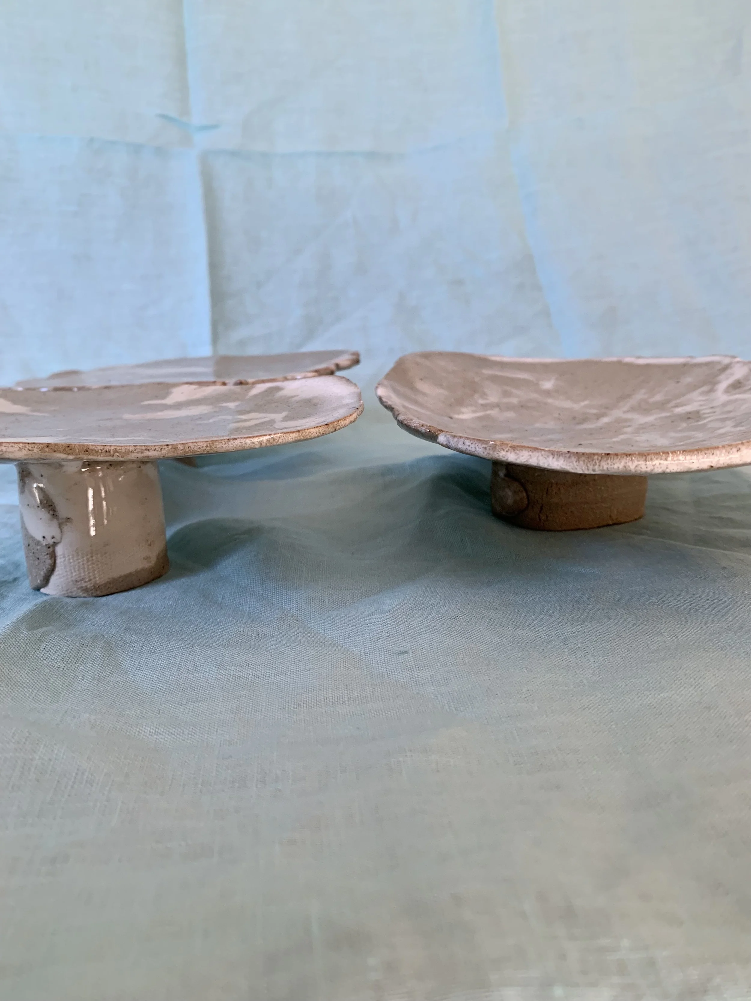 Two medium stilted Nerikomi serving dishes, clear glazed stoneware with slip