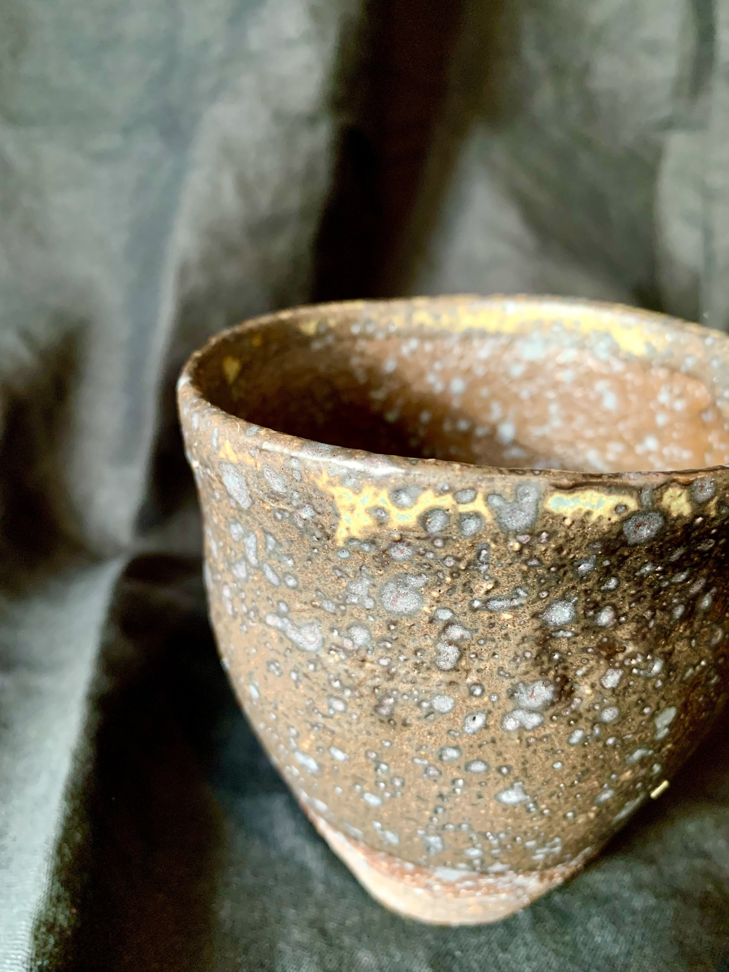 Reduction fired dark stoneware cup