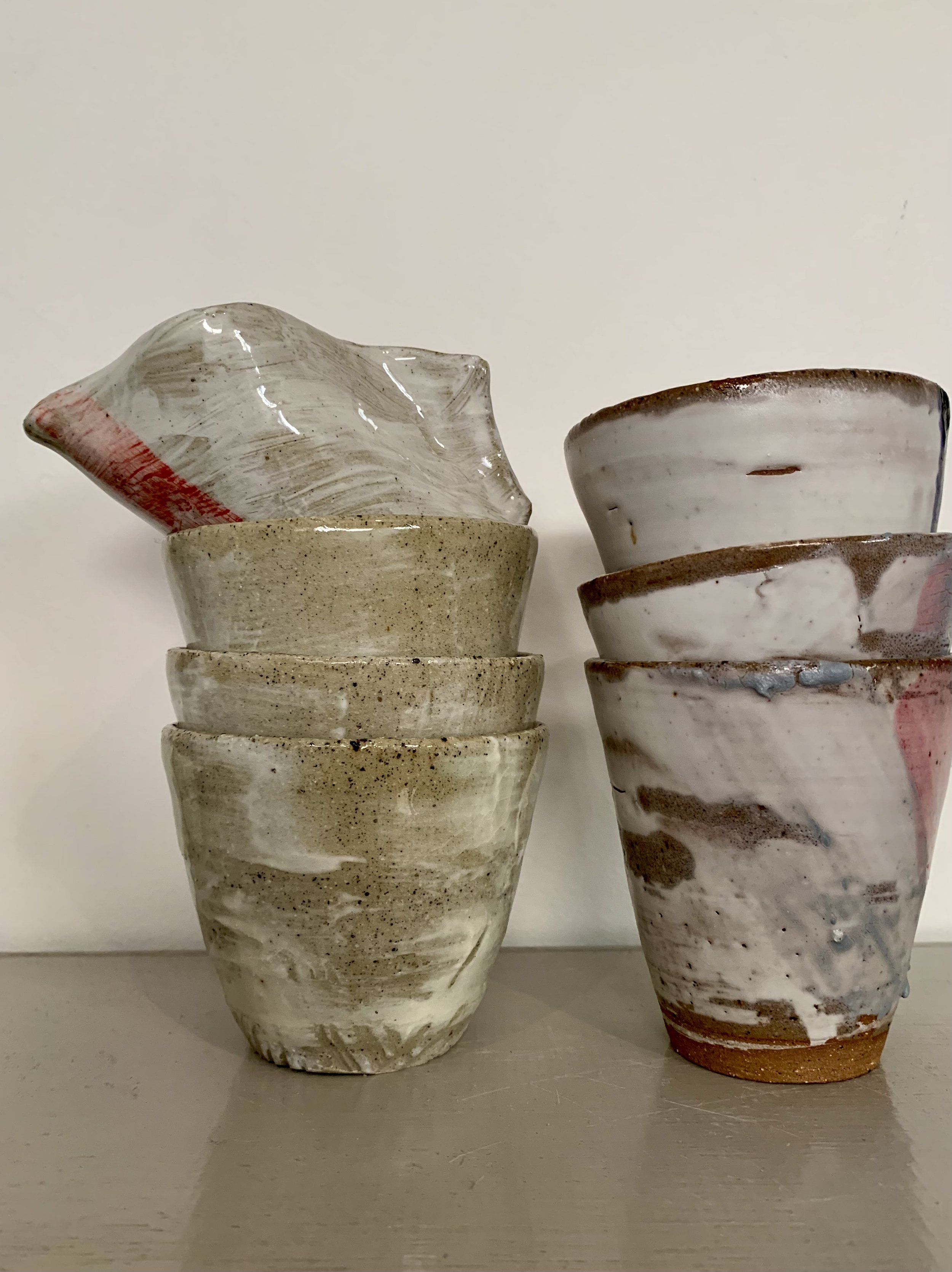 Slip decorated stoneware tumblers and pourer