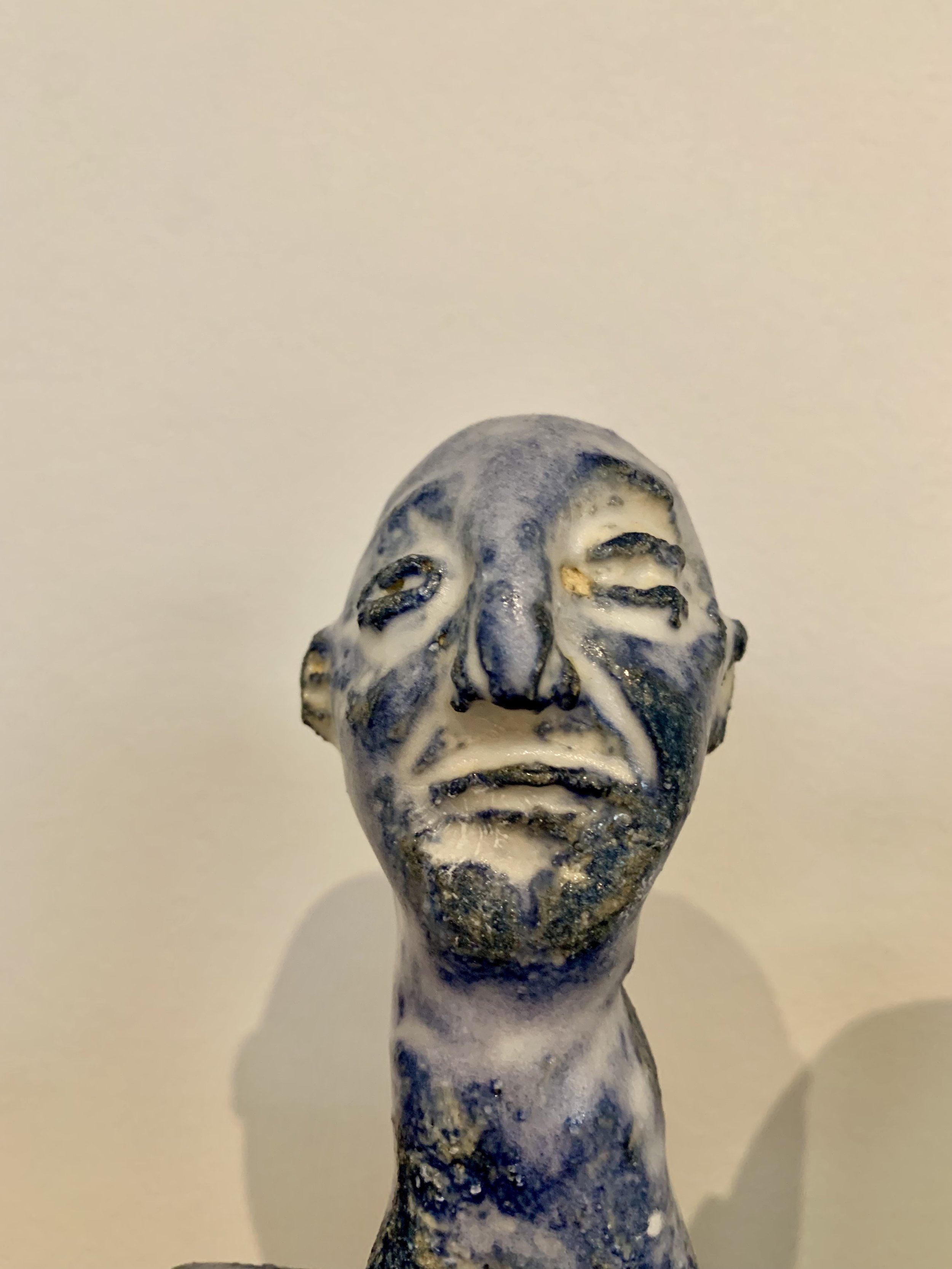 Detail of Blue figure, 2025, Raku clay, coloured slip, glaze