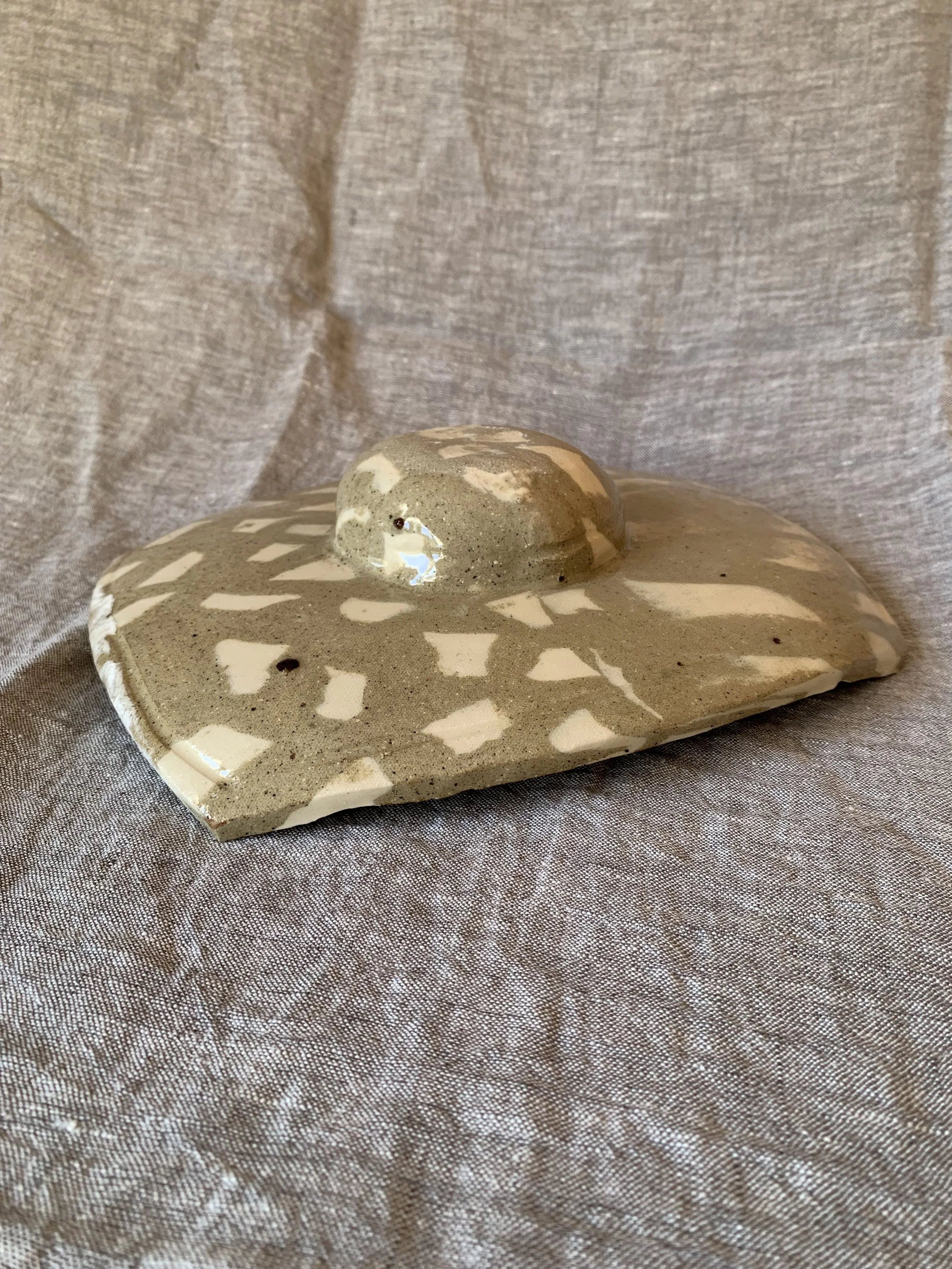 Underside of sculptural squared Nerikomi serving dish, clear glazed stoneware