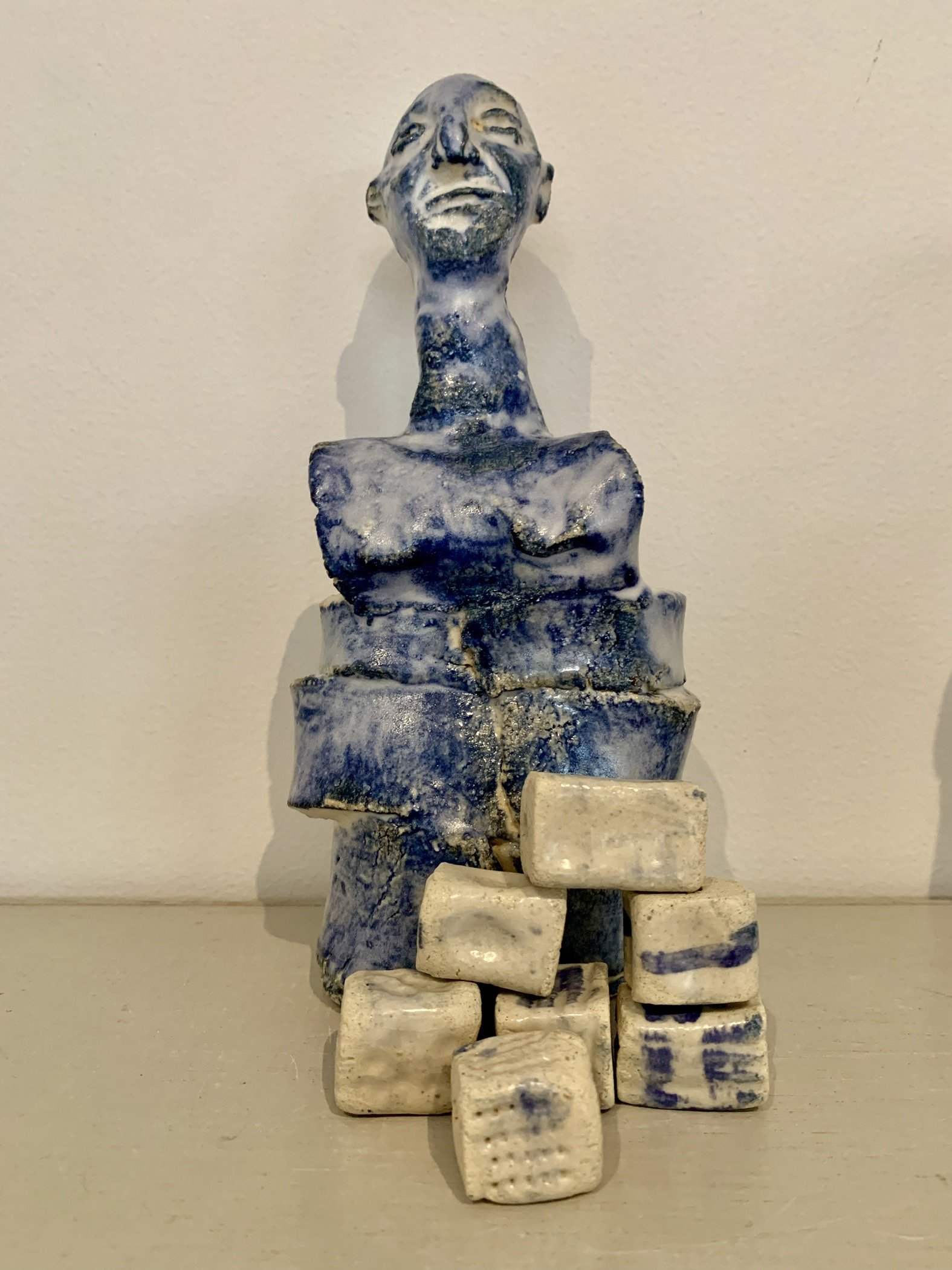 Blue figure with textured beads, 2025, Raku clay, coloured slip, glaze