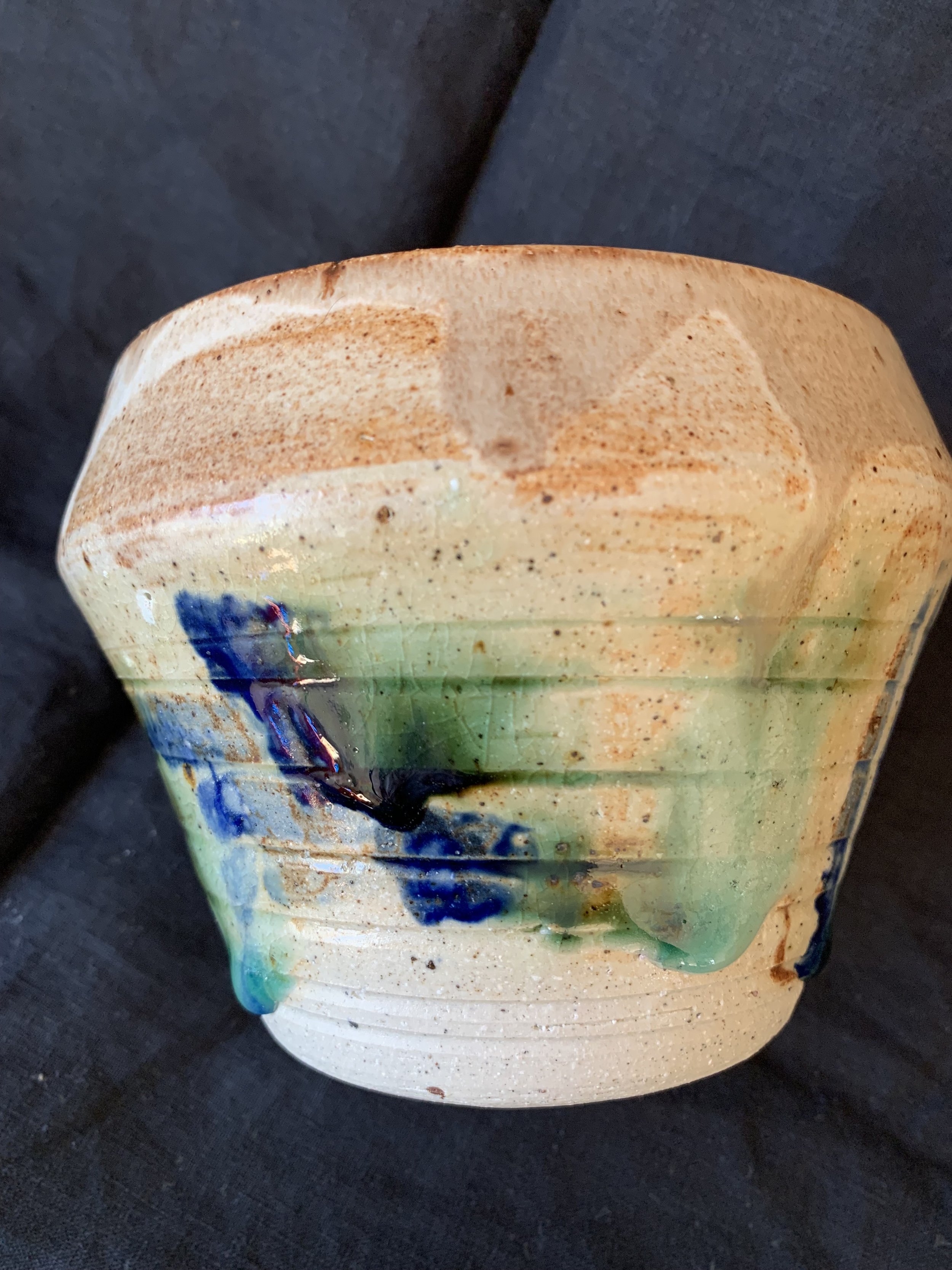 Stoneware vessel decorated with oxides and glazes incorporating reclaimed materials
