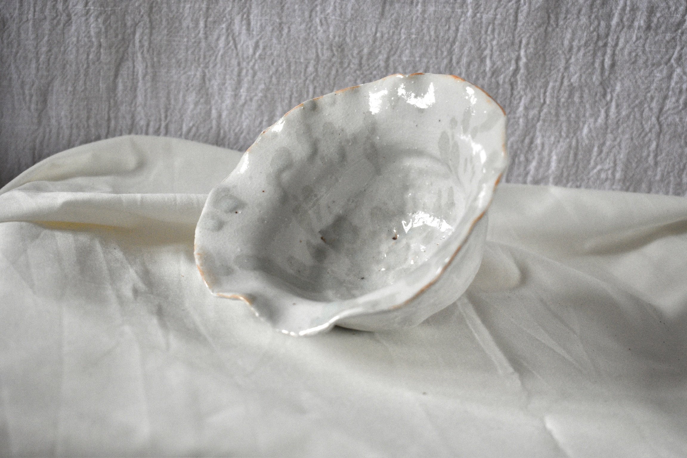 Small shell form, 2025. Thrown and altered stoneware with ash and glaze
