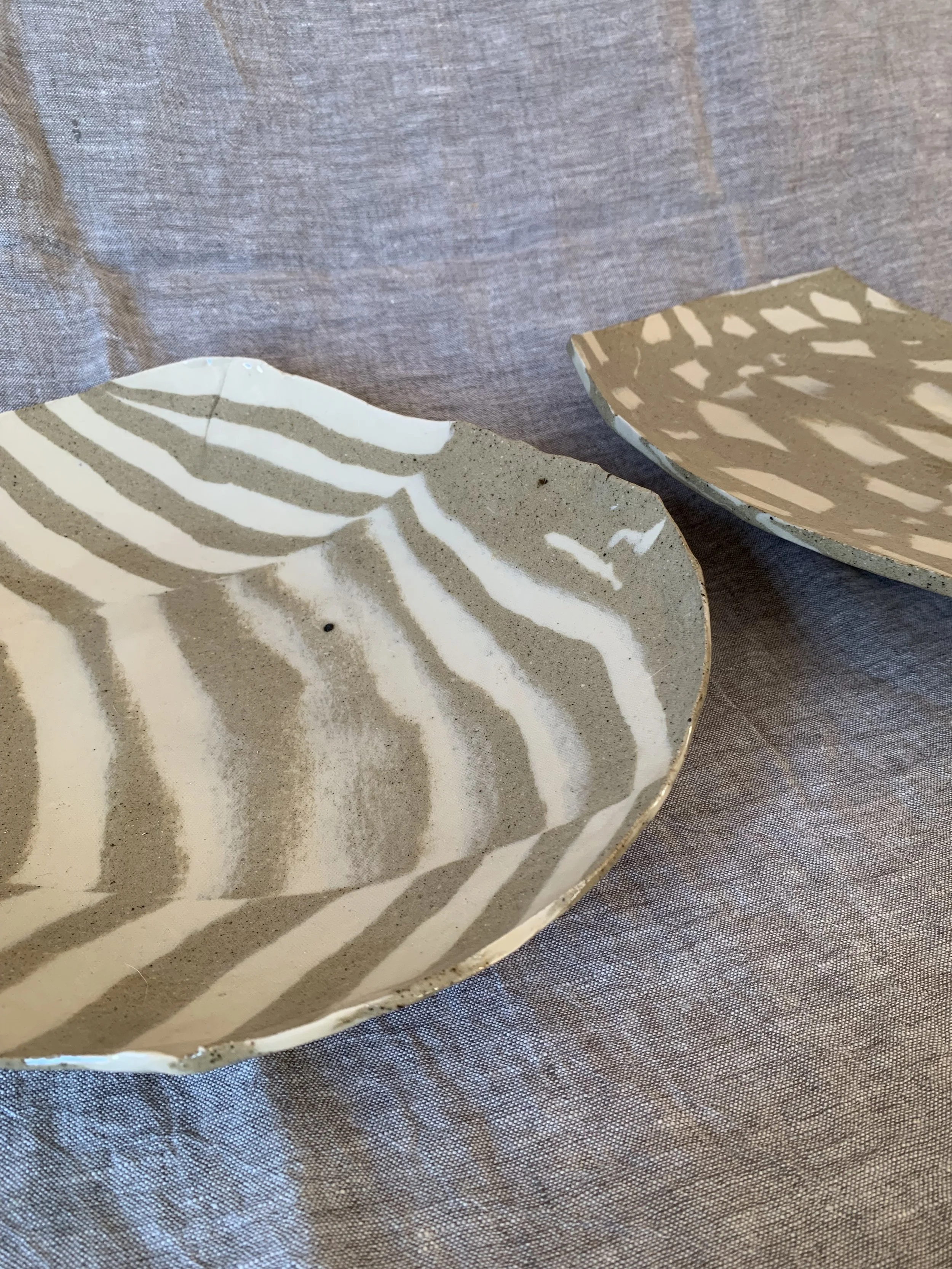 Large striped Nerikomi serving dish and sculptural squared Nerikomi serving dish, clear glazed stoneware
