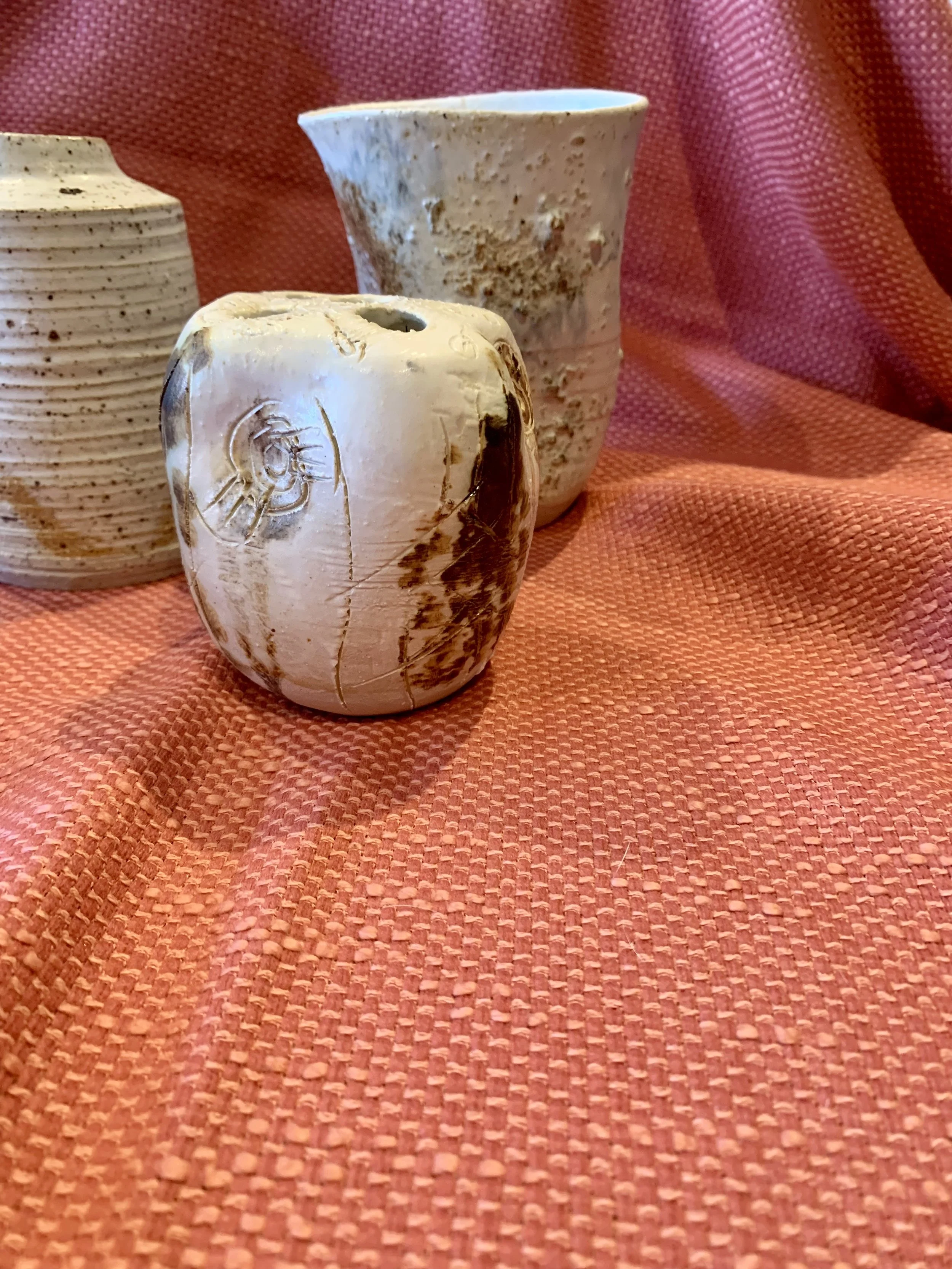 Thrown and altered stoneware vase with texture and oxide colouring, thrown and textured narrow-necked stoneware vase, and thrown and altered stem vase with texture and oxide colouring