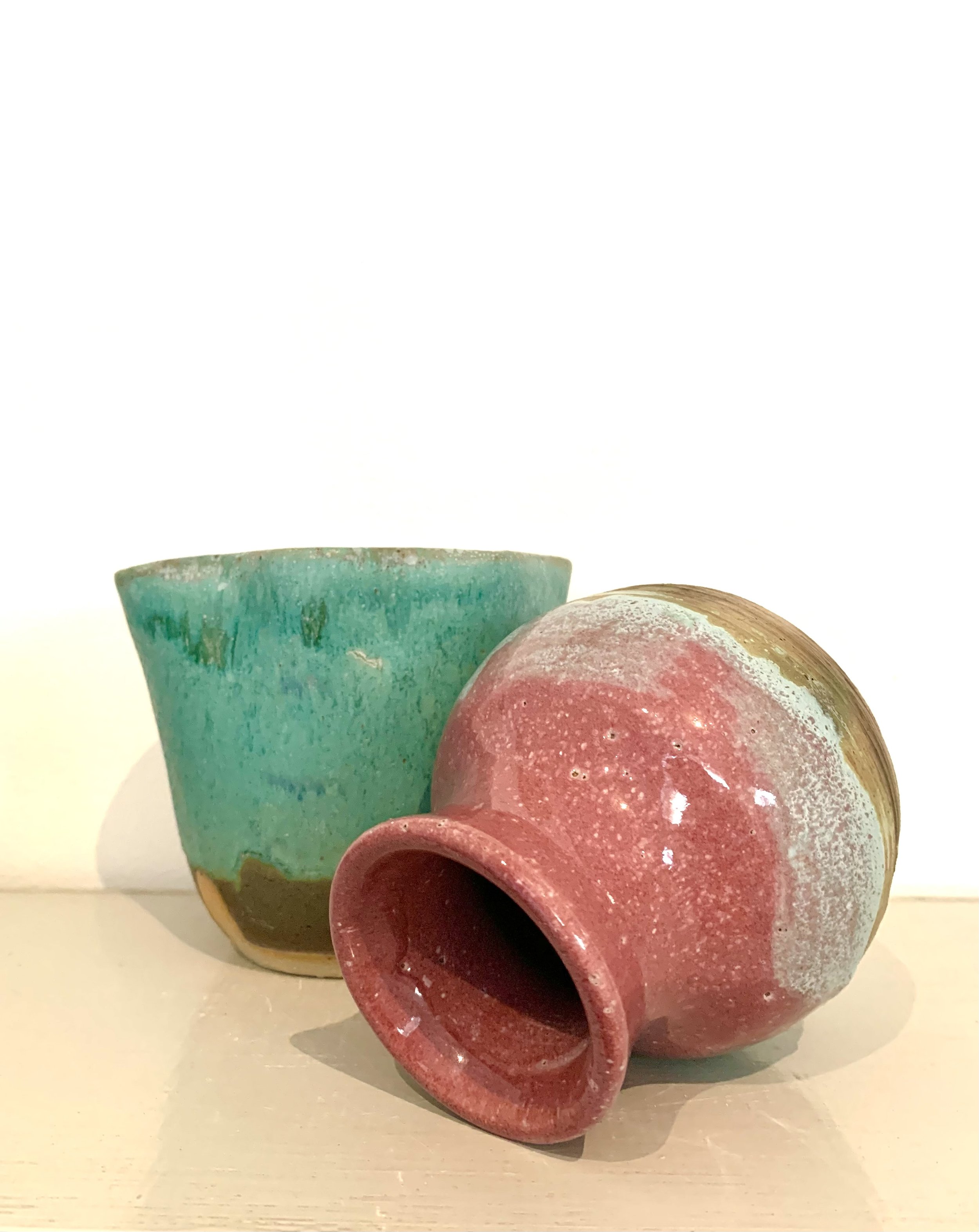 Pink thrown stoneware vase and bronzed green thrown and altered stoneware vase
