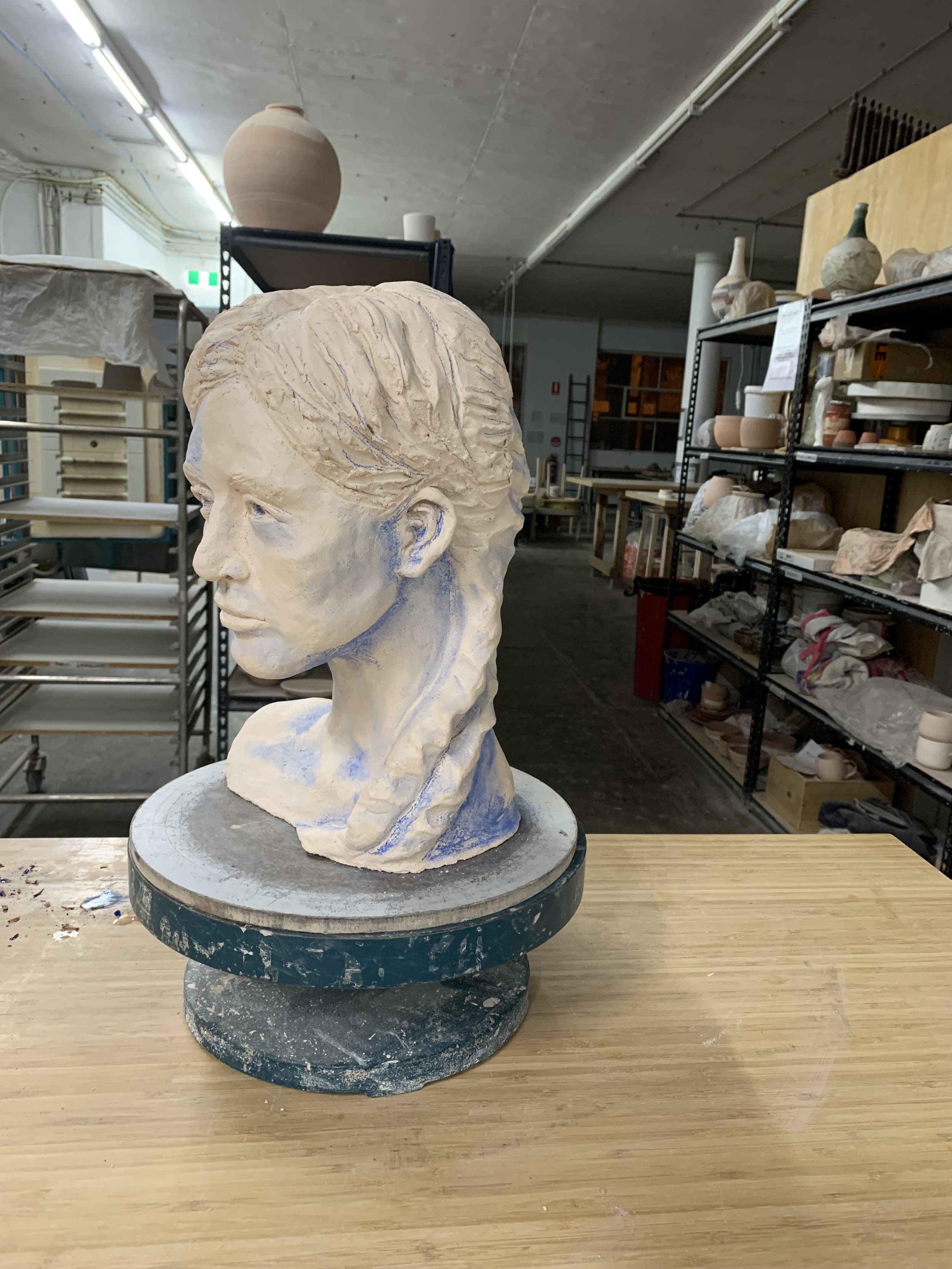 Bust in progress, underglazing, 2025, Raku clay