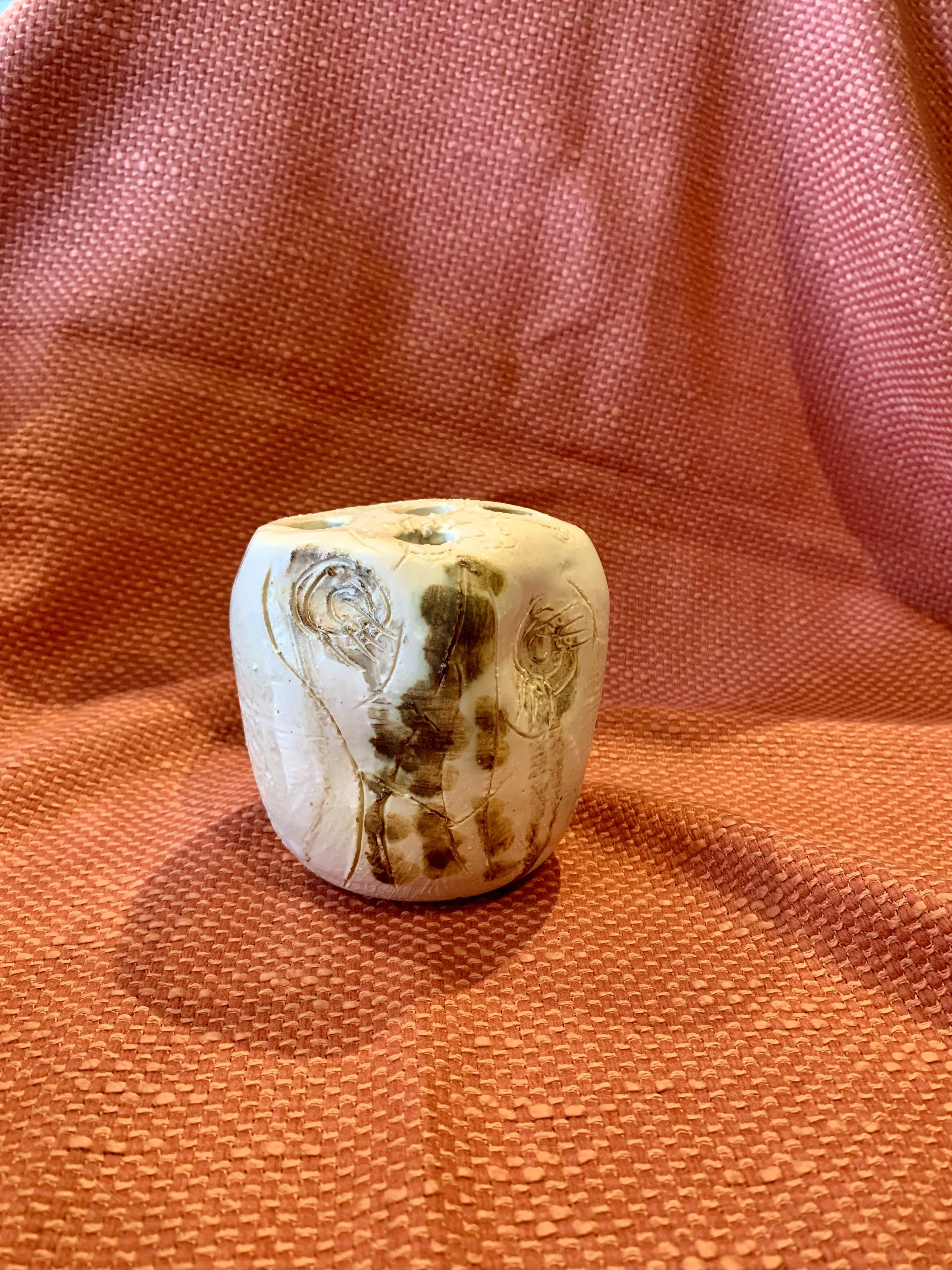 Thrown and altered stem vase with texture and oxide colouring