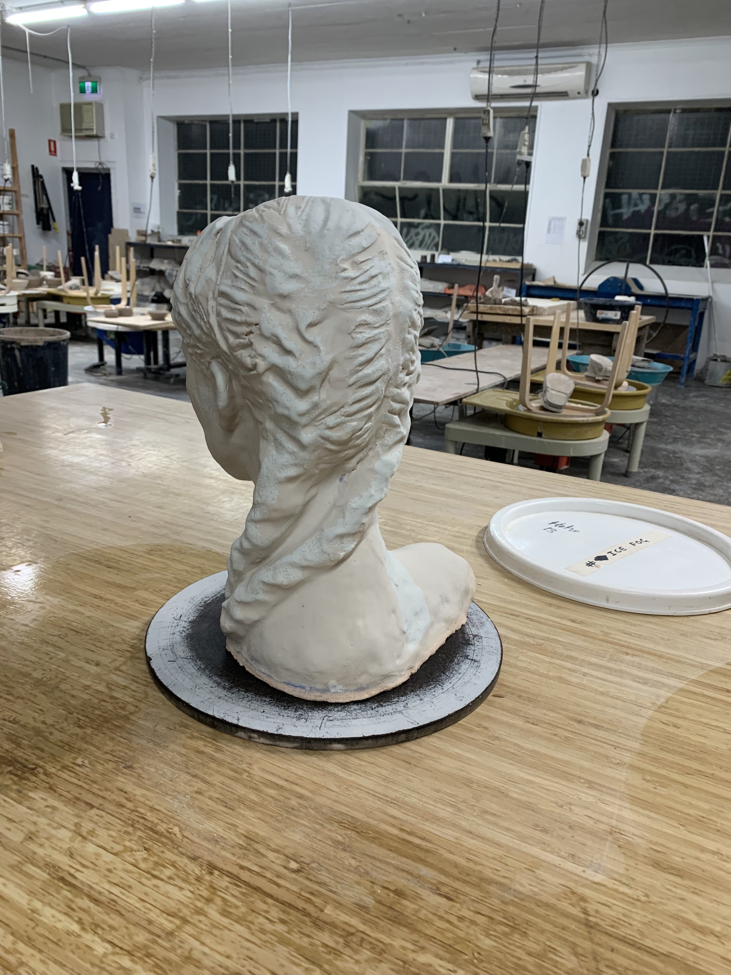 Bust in progress, glazed but not fired, 2025, Raku clay