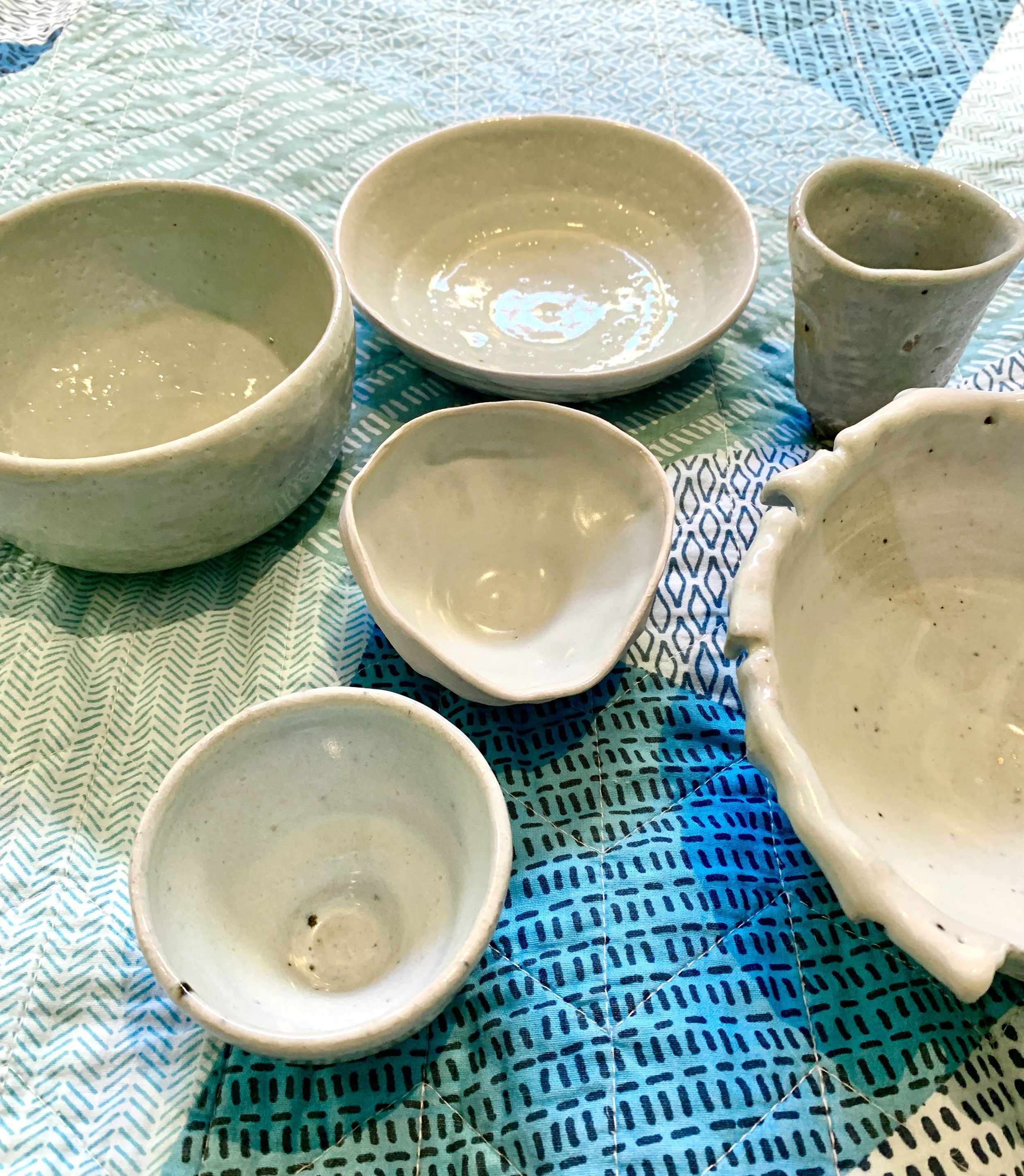 Collection of shino and ash glazed stoneware vessels
