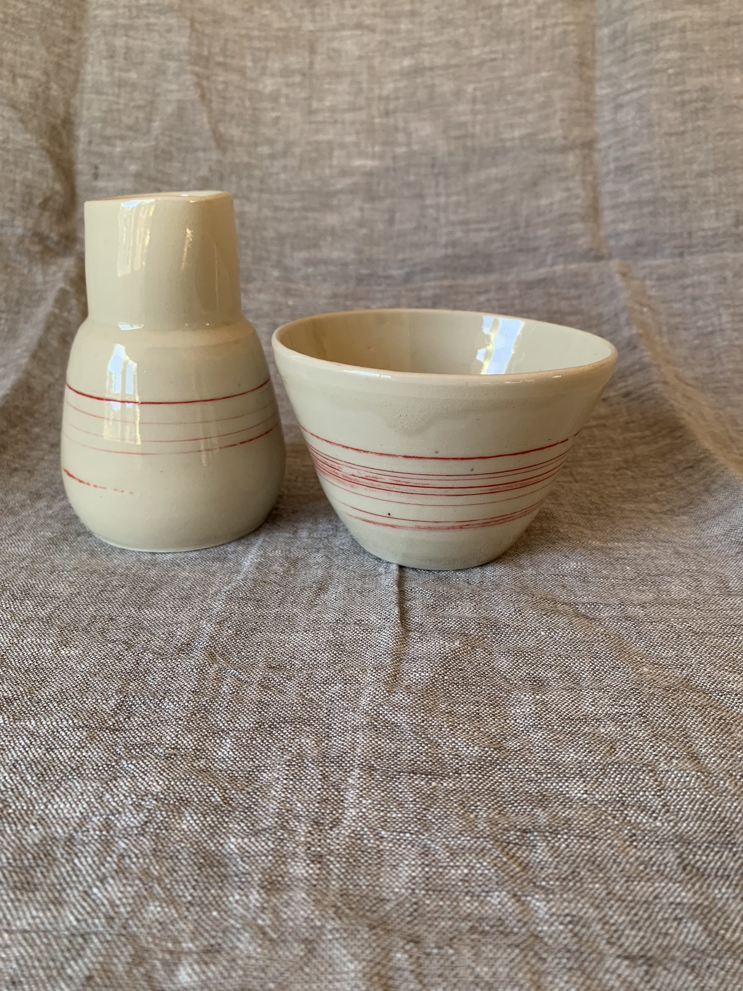 Small stoneware bowl and pourer with inlaid slip decoration