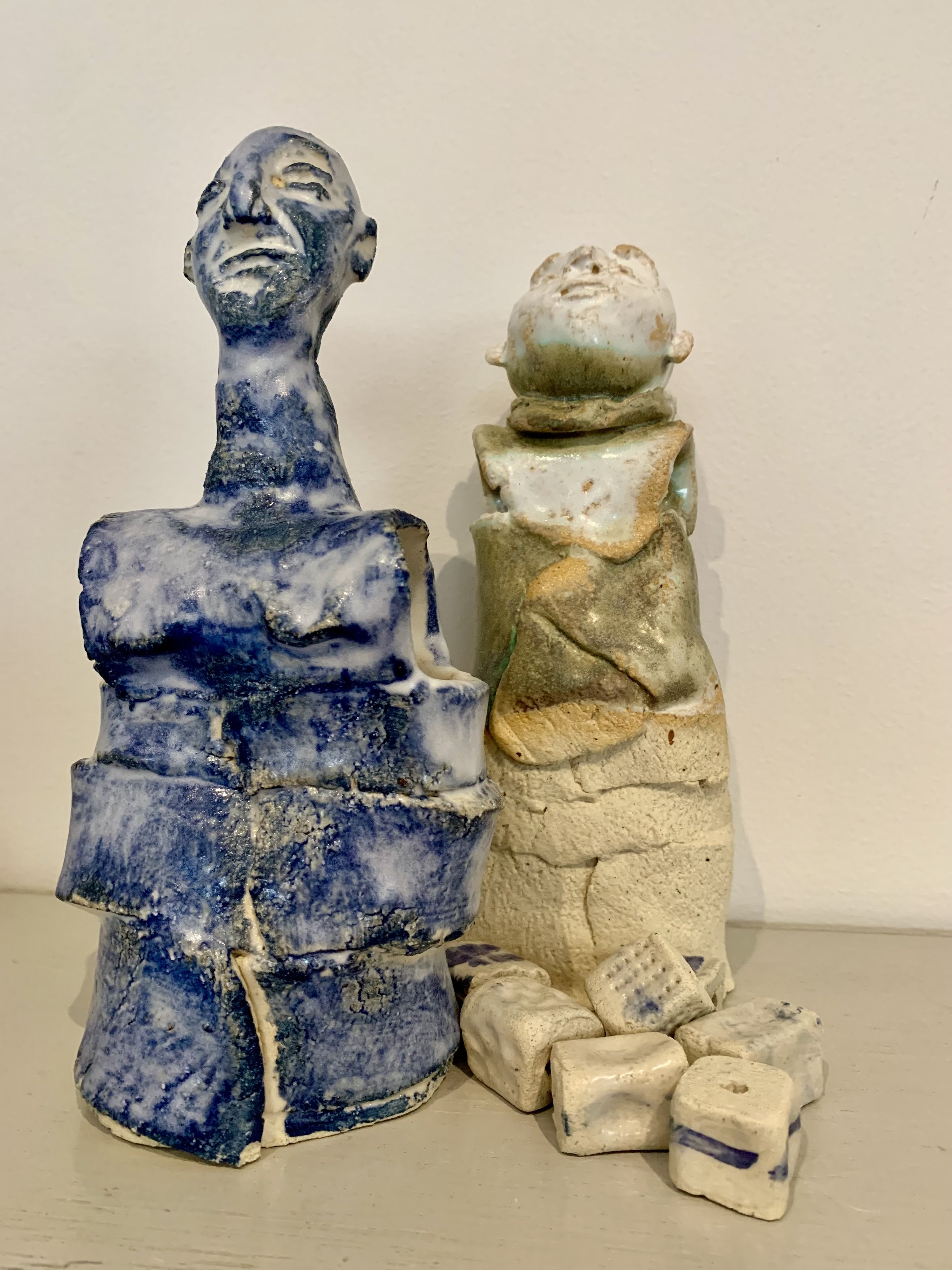 Blue figure and Bronze figure with textured beads, 2025, Raku clay, coloured slip, glaze
