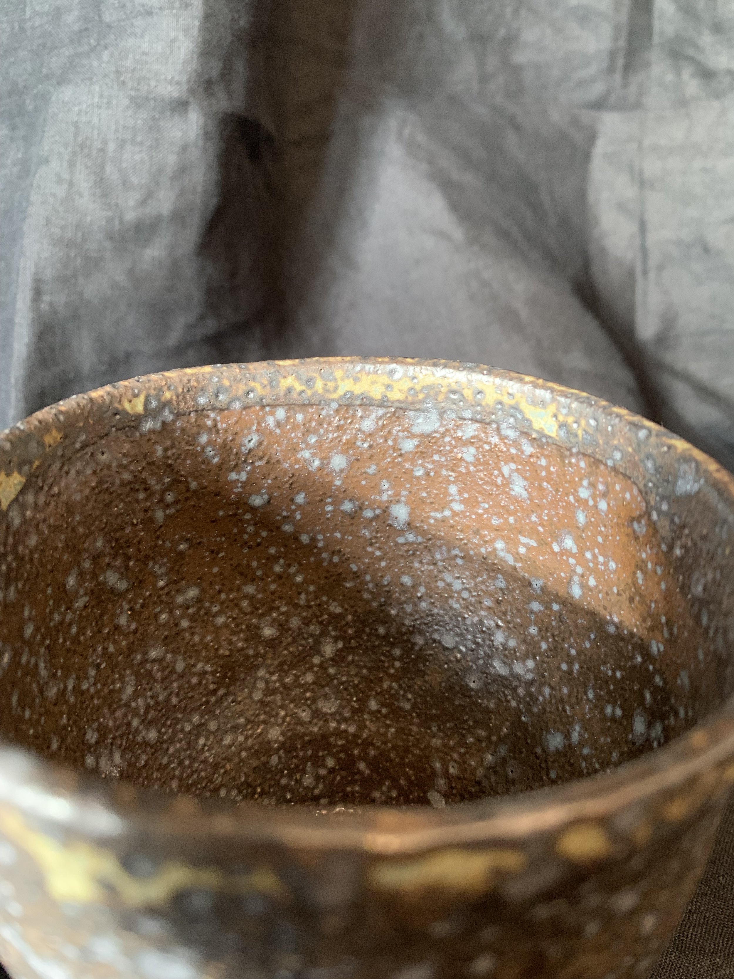 Detail, reduction fired dark stoneware cup