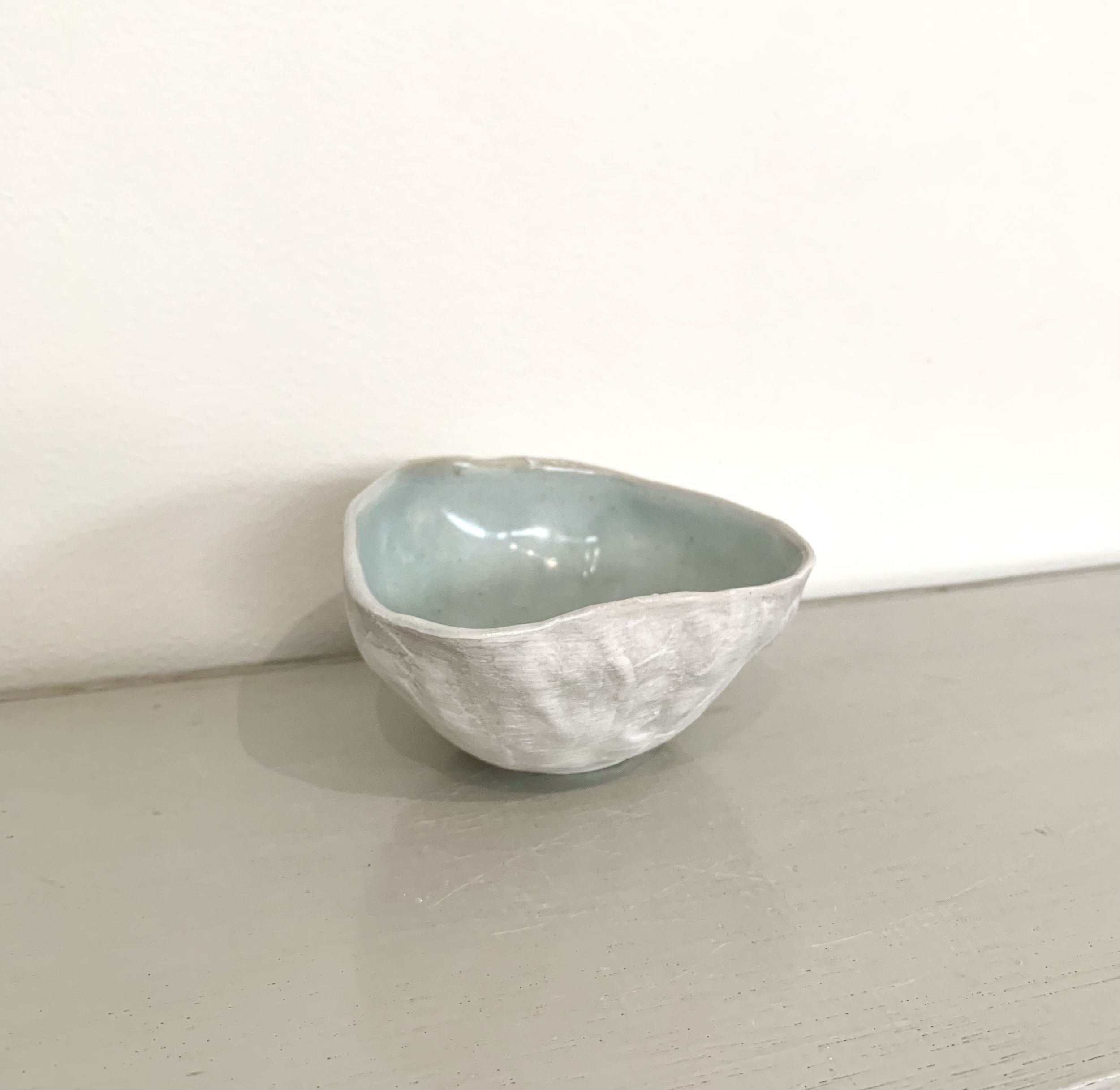 Small shell bowl, slip with shino and ash glaze