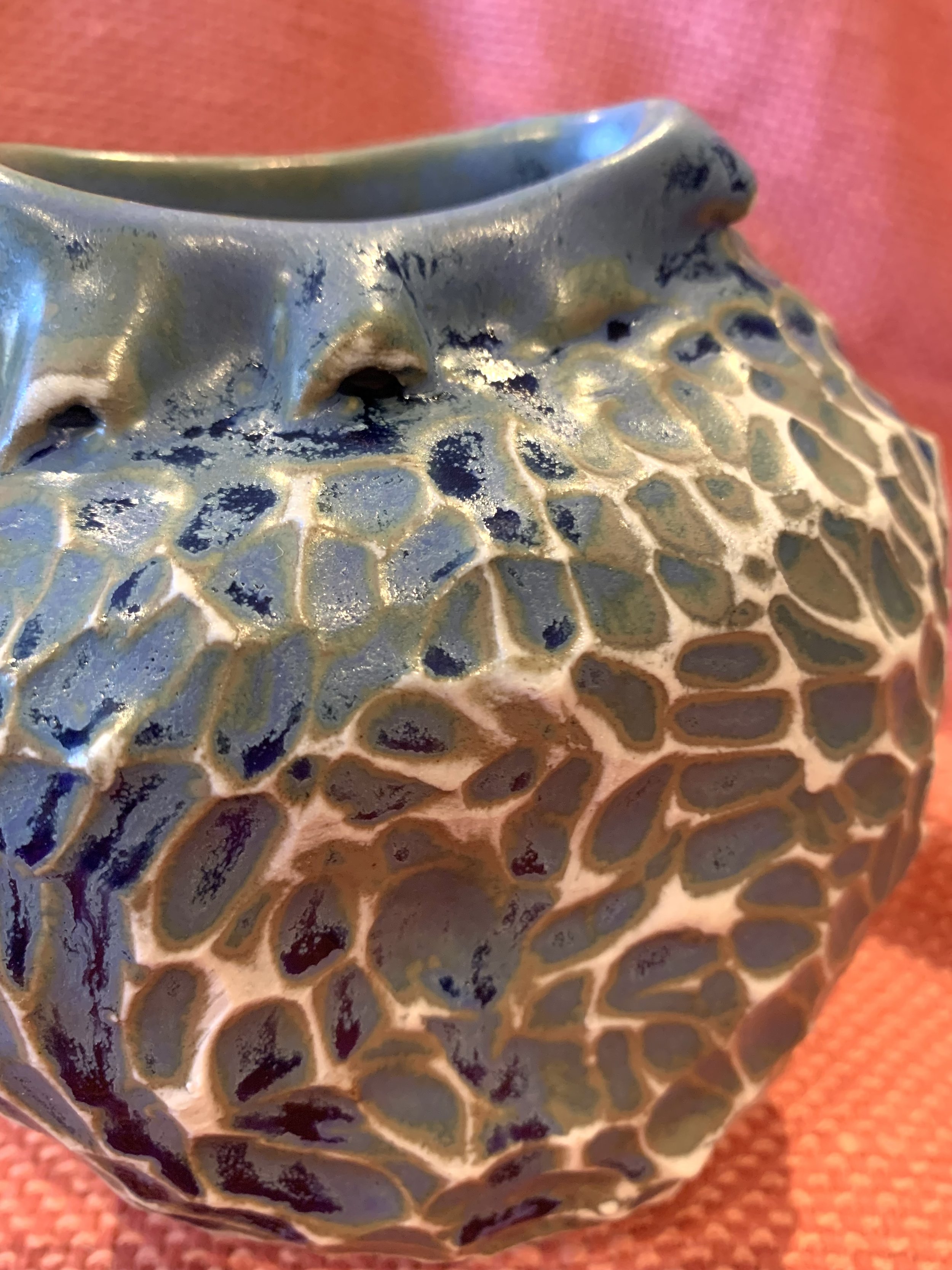 Detail, frill necked and softly faceted thrown and altered vase, glazed stoneware